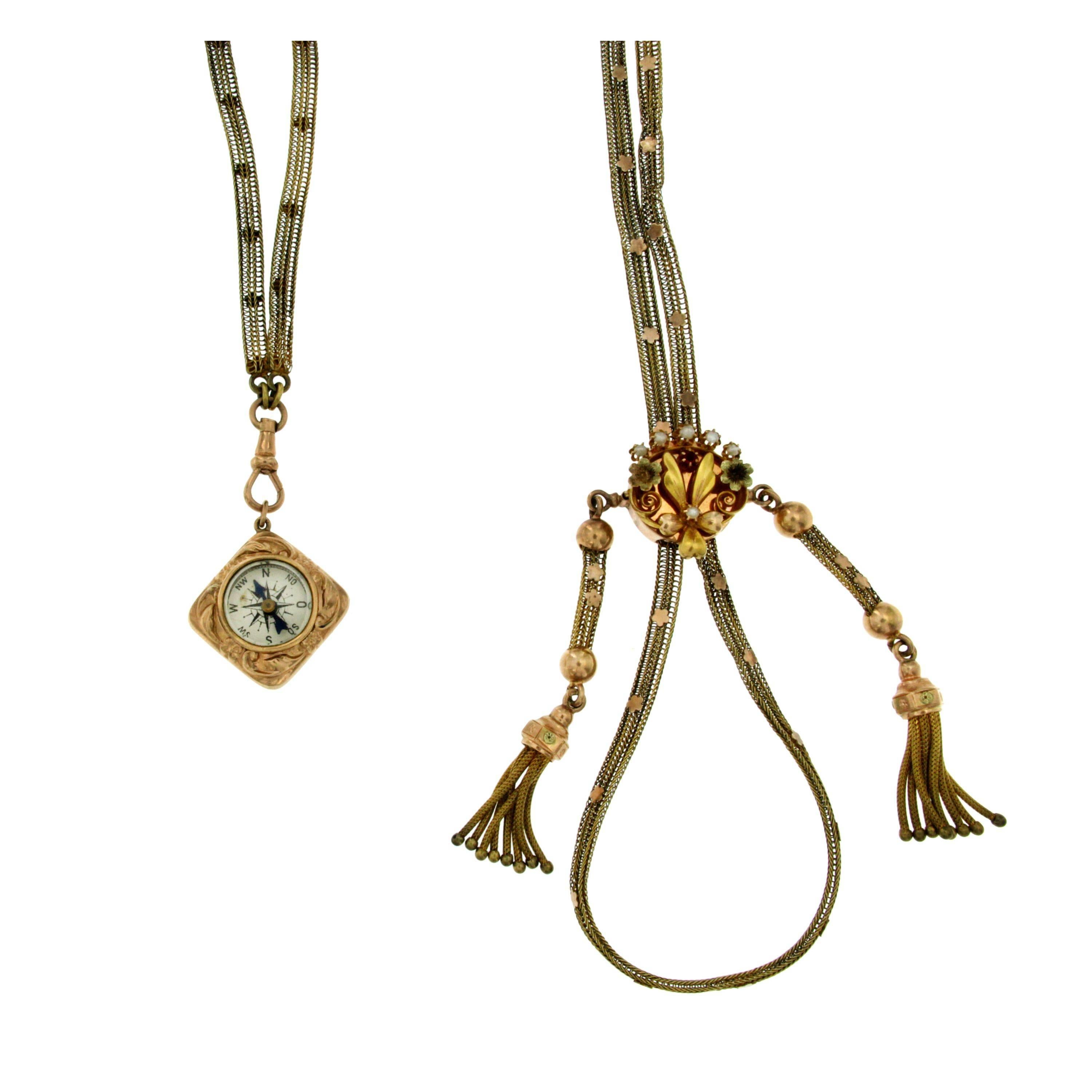 Antique Bourbon necklace from Italy XIX Century.
Totally handcrafted in the traditional way in 12k gold and set with small pearls  semi precius stone, gold leaves. 
One pendant going up and down the chain, the other pendant is a reversible compass