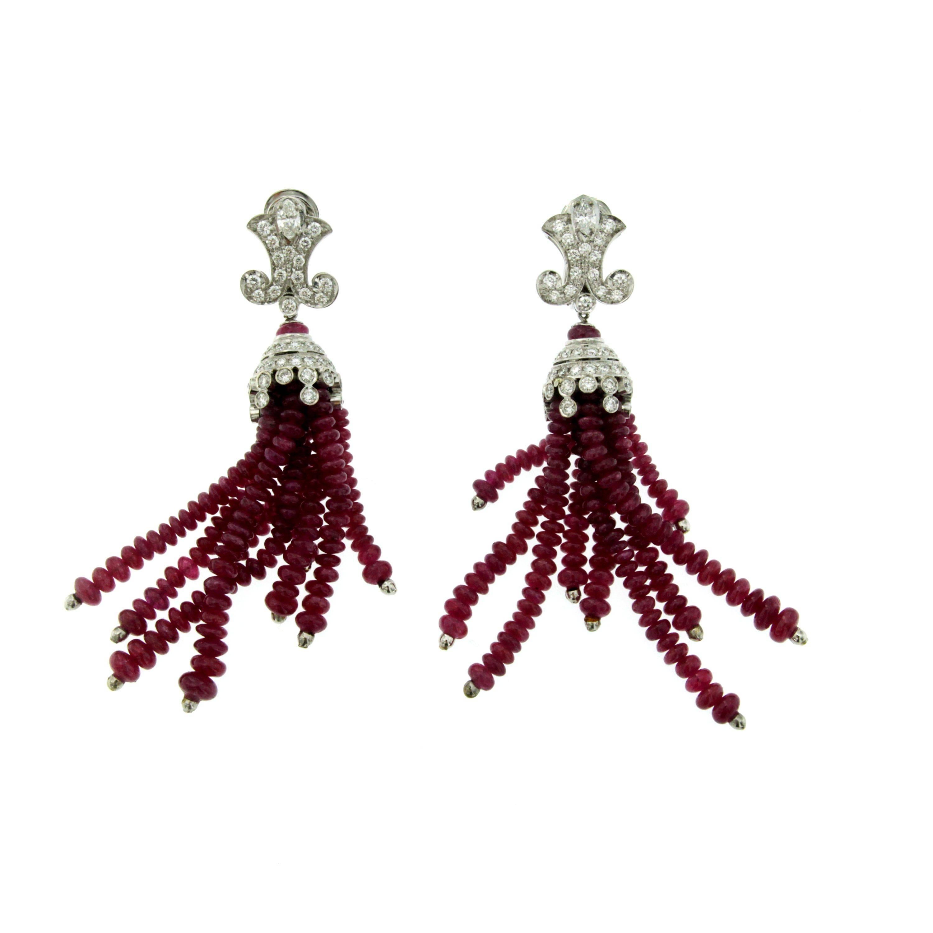 This wonderful pair of earrings feature 90 carats of Rubies and 3.60 cts of round brilliant cut diamonds G color IF clarity. Contemporary

CONDITION: Brand new
METAL: 18k Gold 
STONE: Ruby 90 total carats - Diamond 3.60 total carats
MEASURES: height