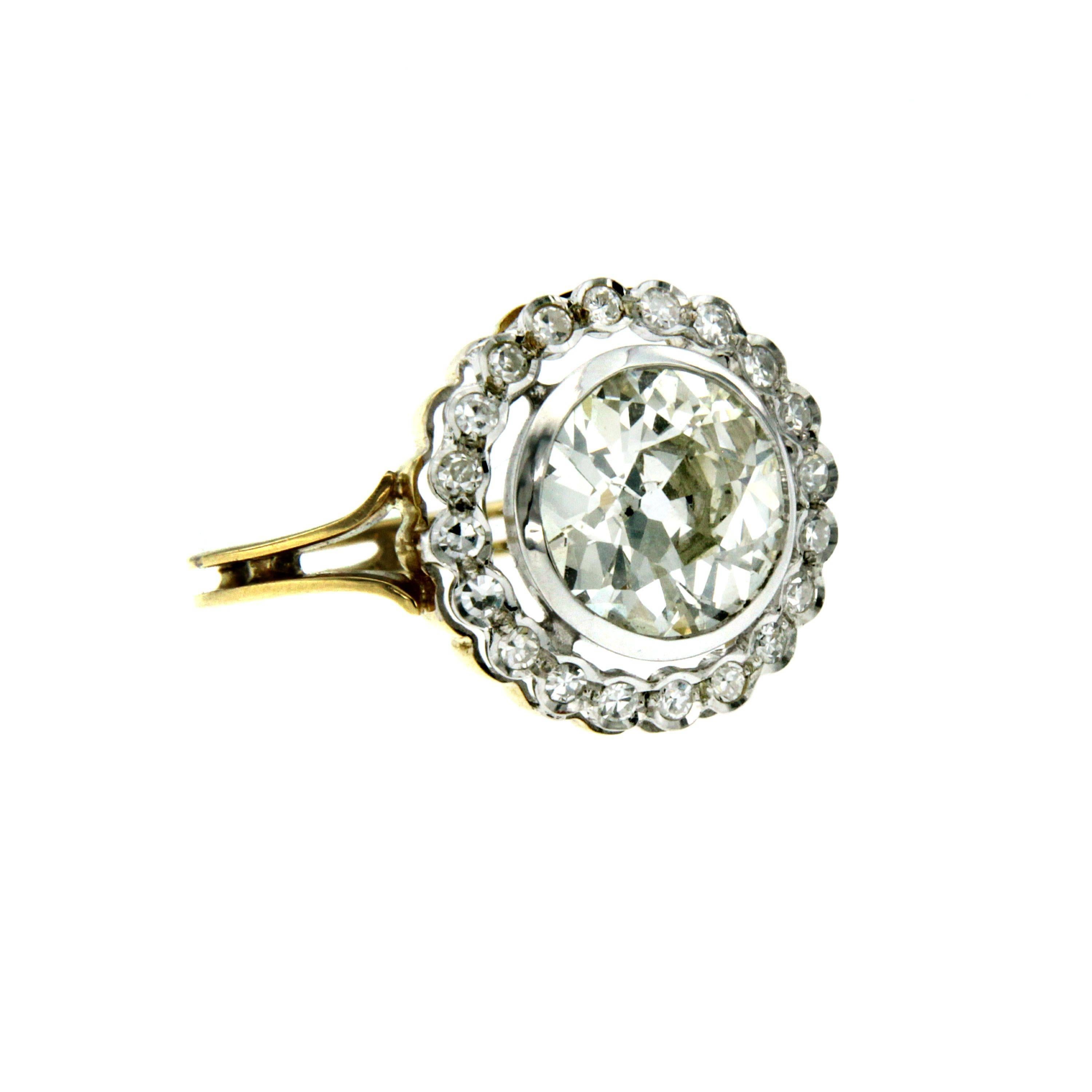 A beautiful Victorian style diamond engagement ring set in 18K yellow and white gold. The ring features a center 3.16 carat old mine cut diamond L color I2 clarity, framing the center diamond are .40ct of old mine cut diamonds.
Entirely hand