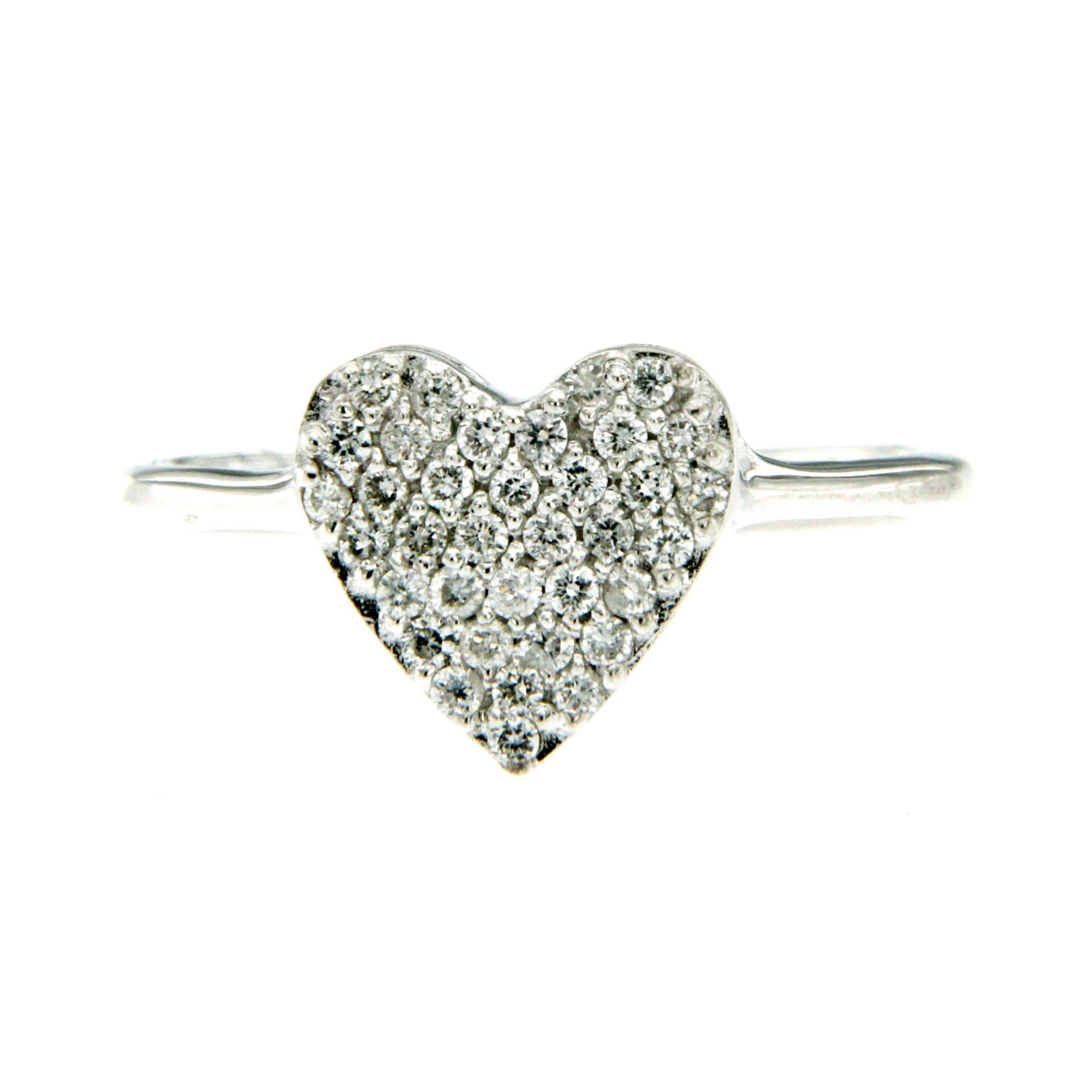 This 18k white gold heart ring is entirely handcrafted and embellished with 0.25-carats of sparkling diamonds.
Wear yours alone or stacked with similar styles.

CONDITION: Brand New
METAL: 18k white Gold
GEM STONE: Diamonds 0.20 total carats 
DESIGN
