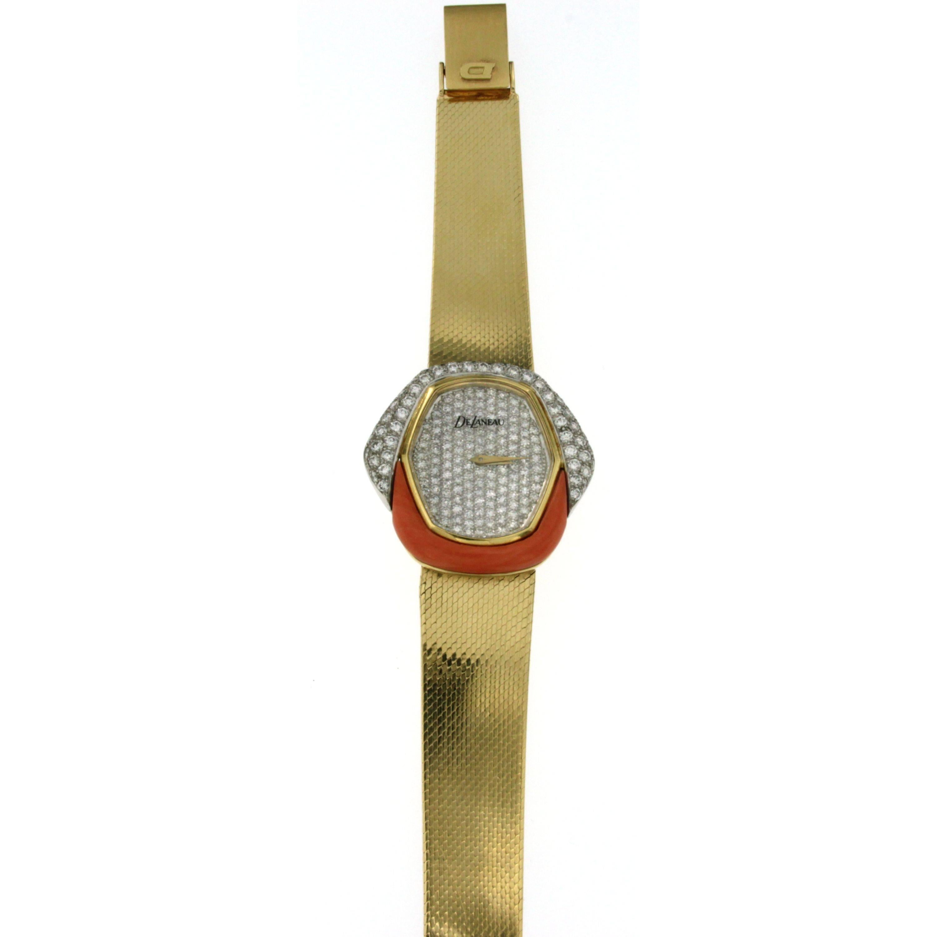 A 750/000 yellow gold vintage Kutchinsky DeLaneau watch. The dial is enhanced with a geometrical made of Coral and Diamonds, 5.00  carats of brilliant cut diamonds graded G Color VVS

Serial: G14*
Condition: 9 - Excellent condition
Age: 1980's
Case
