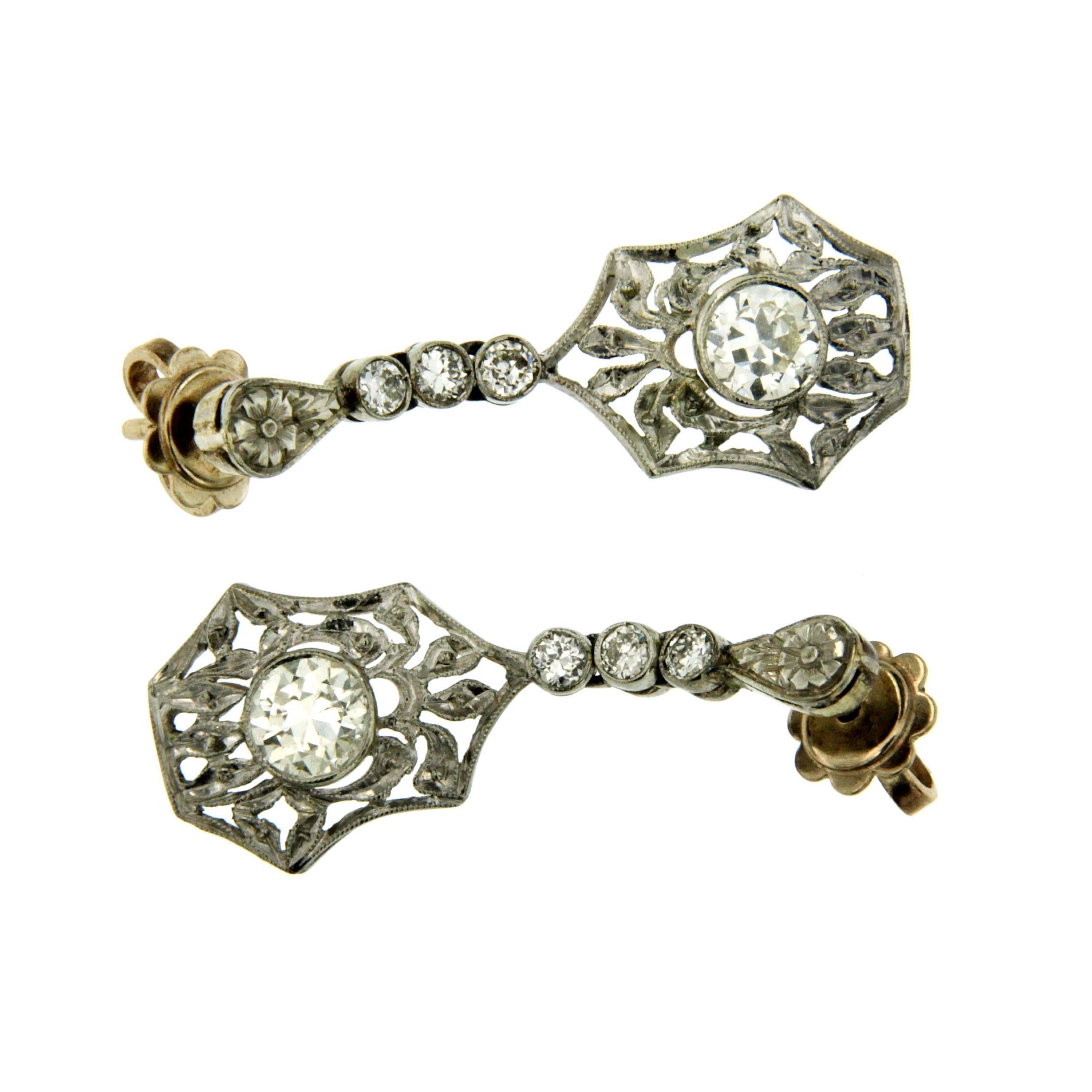 This Art Deco diamond 18k white gold earrings feature sparkling old European cut diamonds weighing approximately 1.00 ct. graded I-J color with VS clarity. 
Circa 1930

CONDITION: Pre-owned - Excellent 
METAL: 18k white Gold 
STONE: Diamond 1.00
