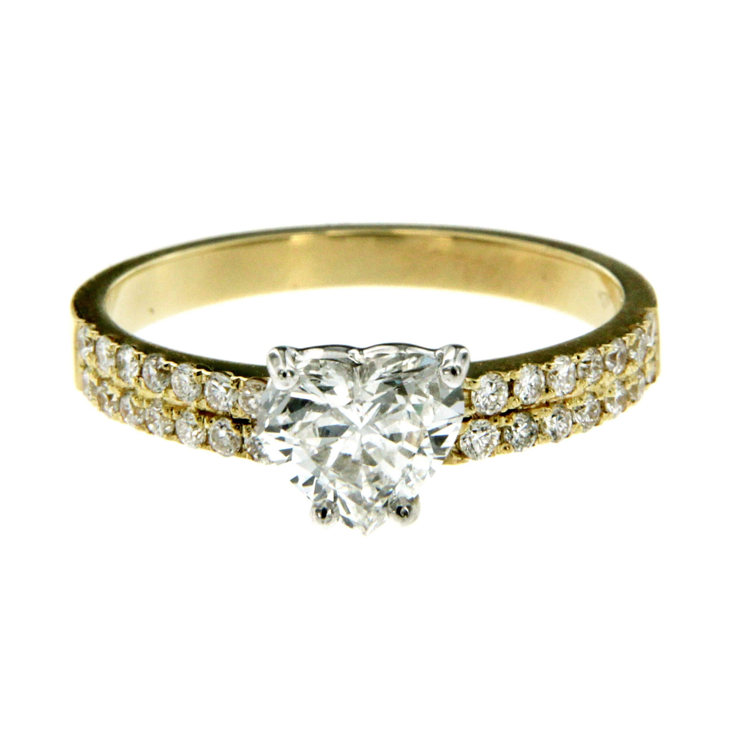 Beautiful and fashion ring hand made in 18k yellow gold
The center diamond in this ring is a 0.80CT GIA Certified Heart Shaped Diamond with I color, Vvs2 clarity. The elegant ring's shank is adorned with 4 lines of  Round Brilliant Cut Diamonds,