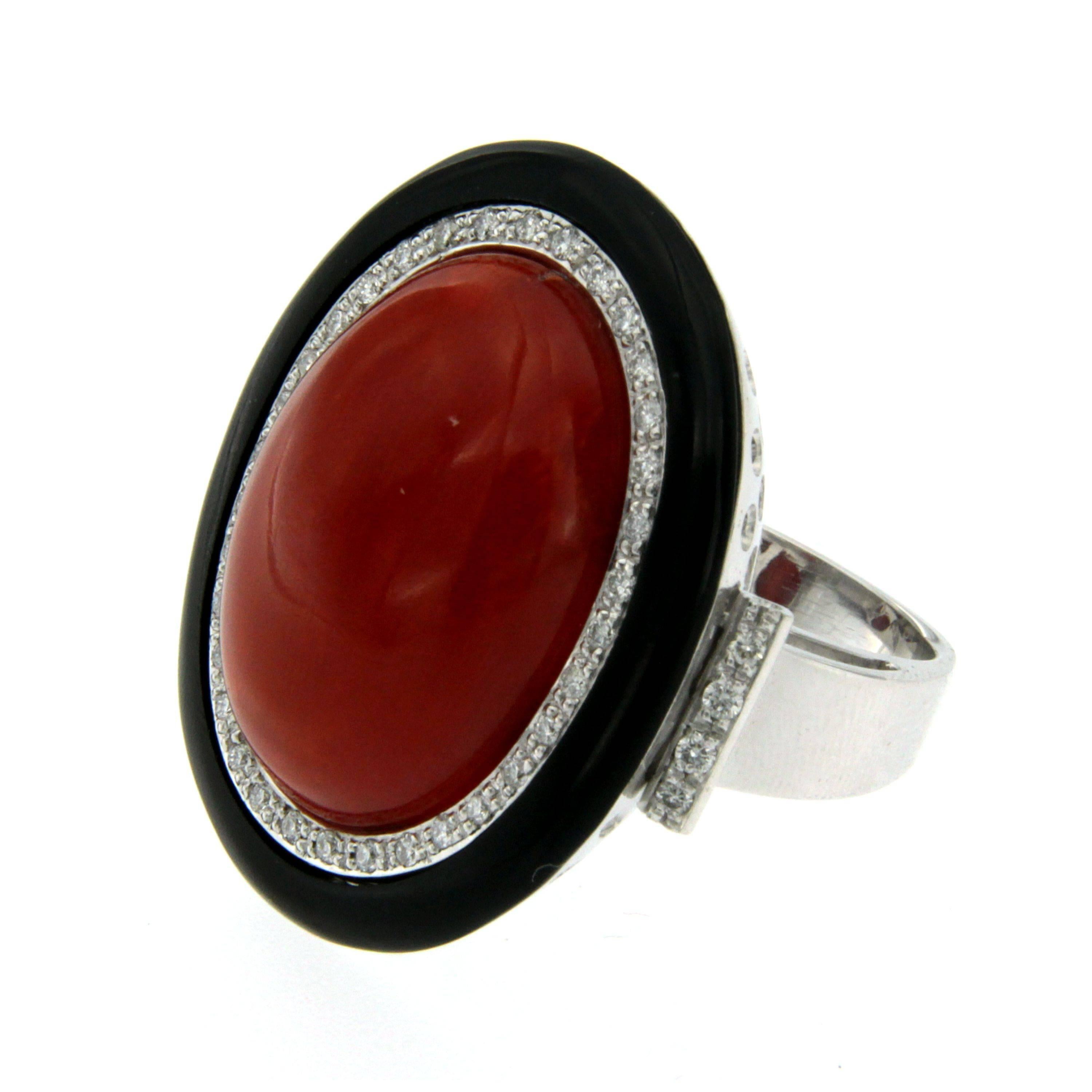 Offered for sale this truly exclusive vintage ring circa 1960' Italian origin

Individually hand crafted of solid 18 Kt white gold (marked) in the finest manner and over cared in the slightest detail
The red Coral cabochon graded Aka (Moro) is of