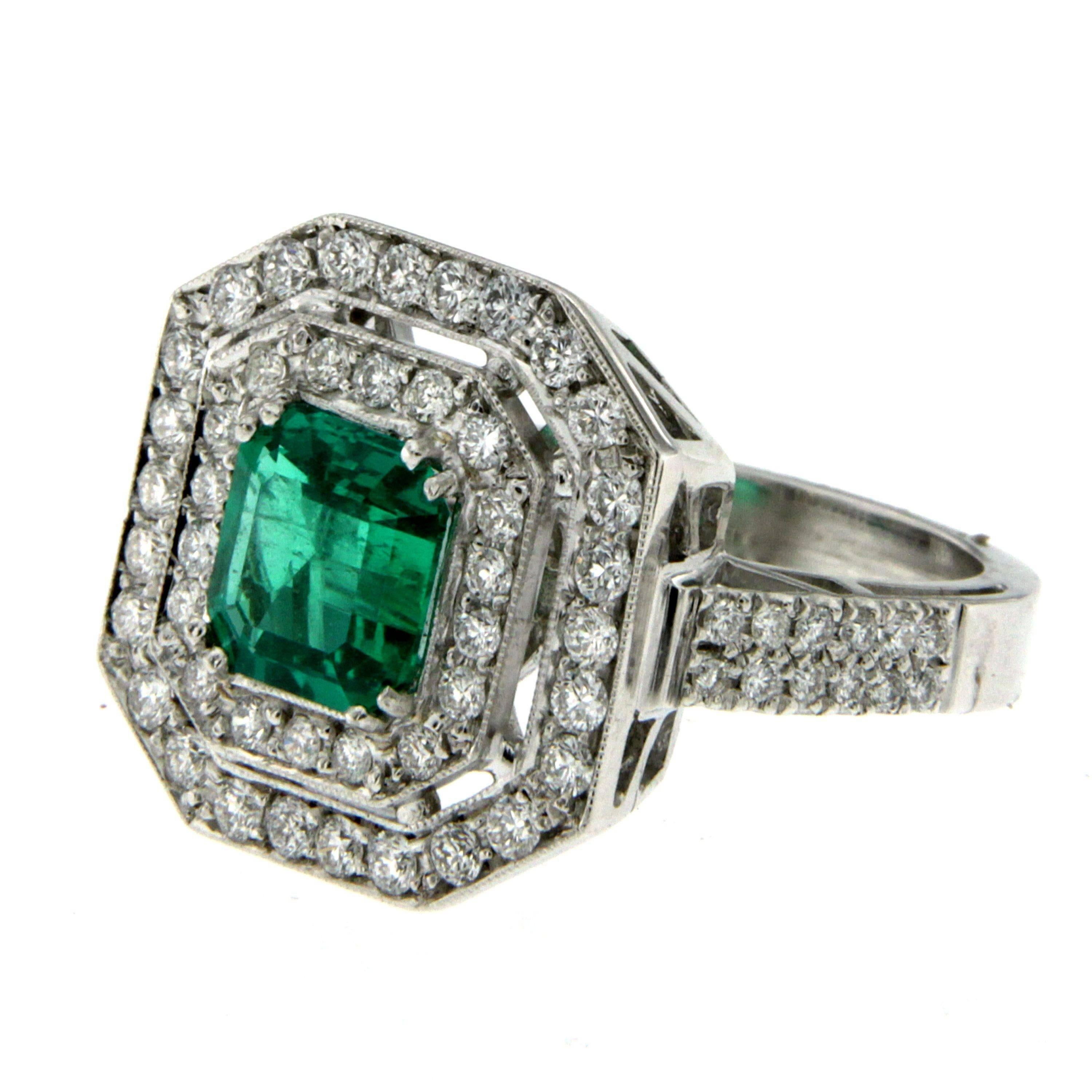 This beautiful handmade Emerald & Diamond Ring is crafted in solid 18k white gold and it weighs approx. 9.00 grams.
The center Emerald is certified by the American Gemological Laboratories (AGL) as a 1.67 cts, emerald cut, natural Beryl Colombian
