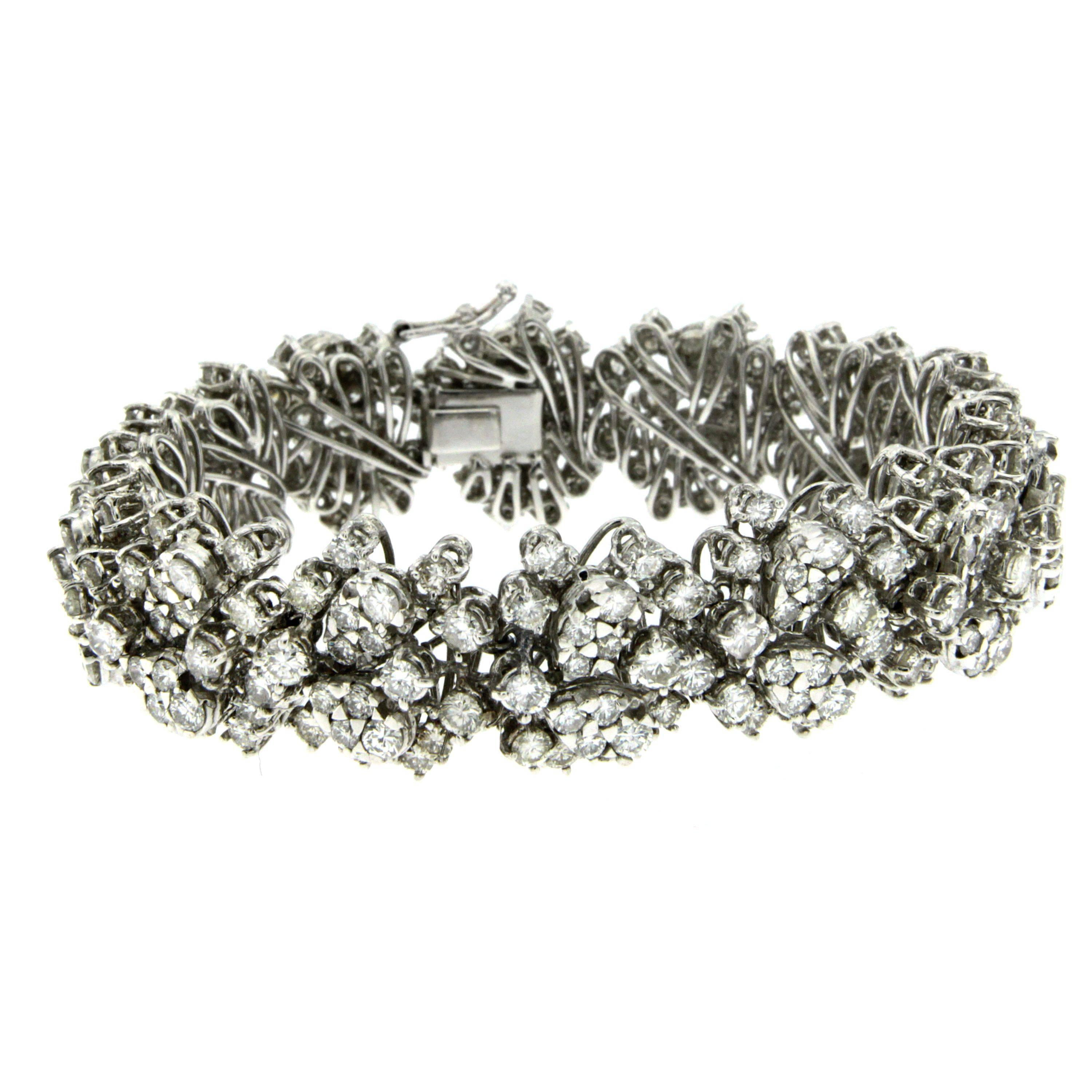 This awesome hand made 18k white gold bracelet is set with sparkling round cut Diamonds weighing approx. 18.00 ct. graded G-H color, VS1 clarity.

The bracelet measures 18.5 cm lenght, 1,5 cm width and secures with a hidden box clasp with safety