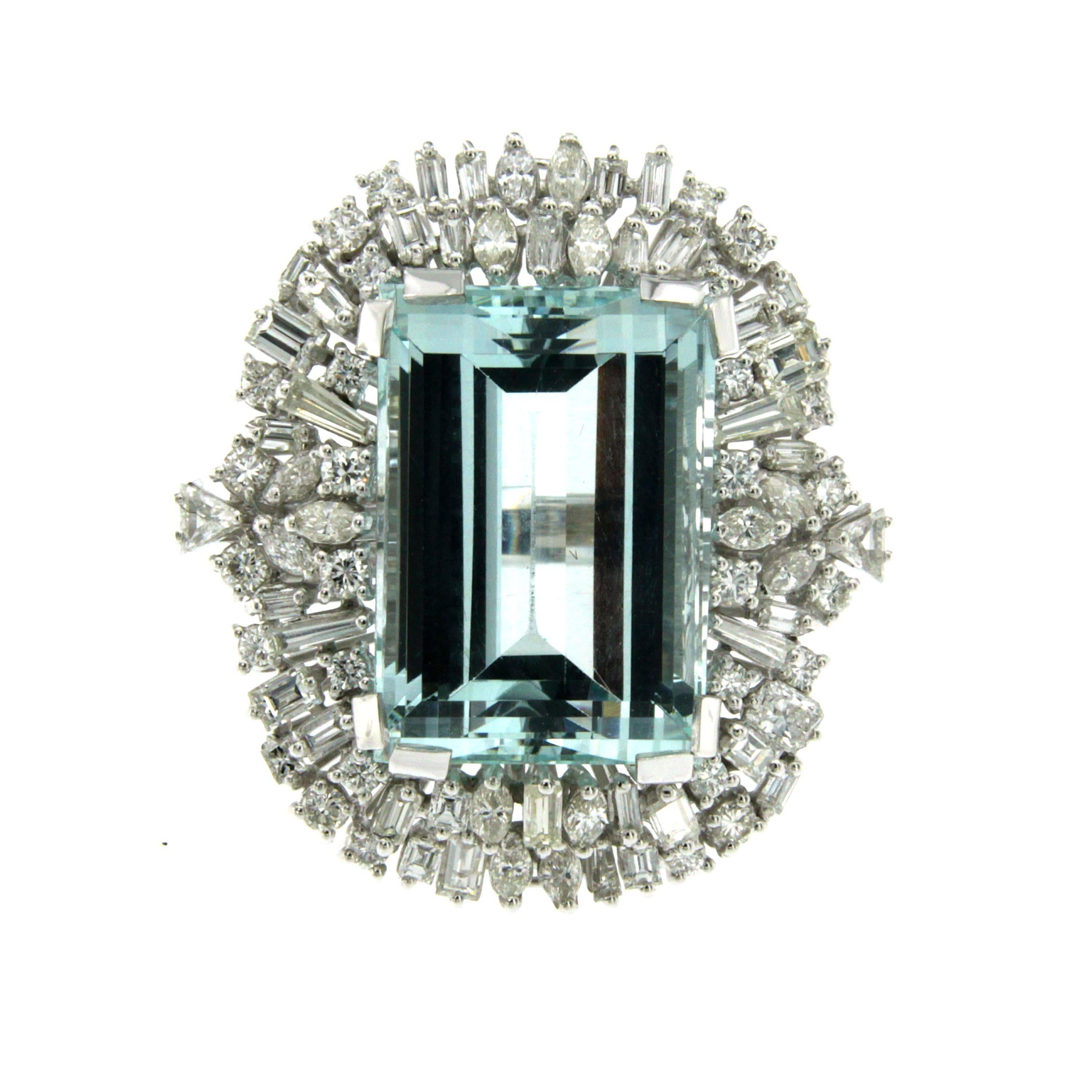 Sensational Aquamarine Ring mounted in 18k white gold set with a rare natural Aquamarine of 35 carat  22.5 x 15.9 mm and surrounded by 4.62 carat of round, navette, baguette, square and trillion cut sparkling Diamonds graded G color