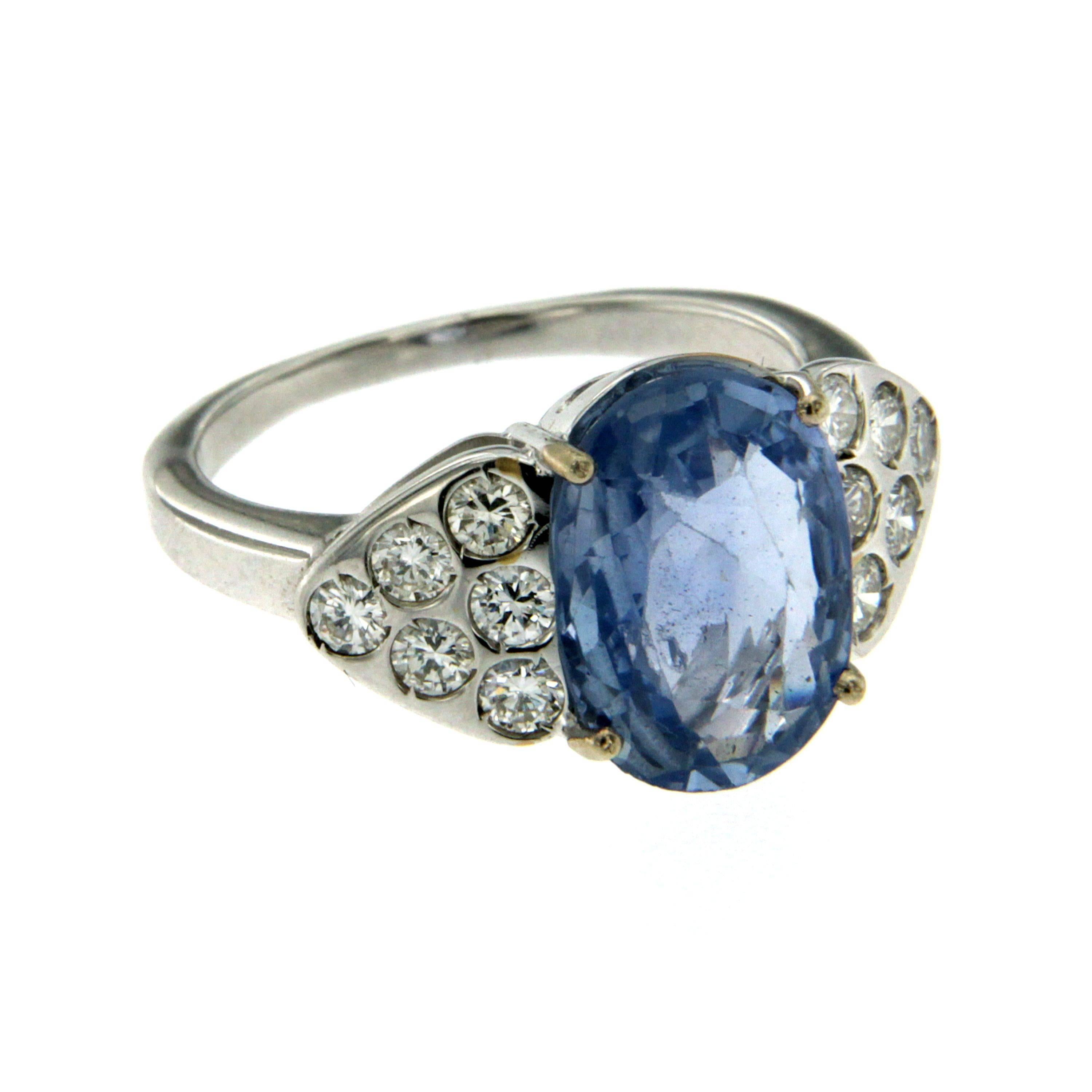 A beautiful sapphire and diamond ring, set with an oval cut Ceylon Sapphire, weighing approx. 3.50 cts  embellished with round brilliant cut diamonds, weighing approx. total of 0.75 cts. Mounted in 18k white gold. 

CONDITION: Brand New
METAL: 18k