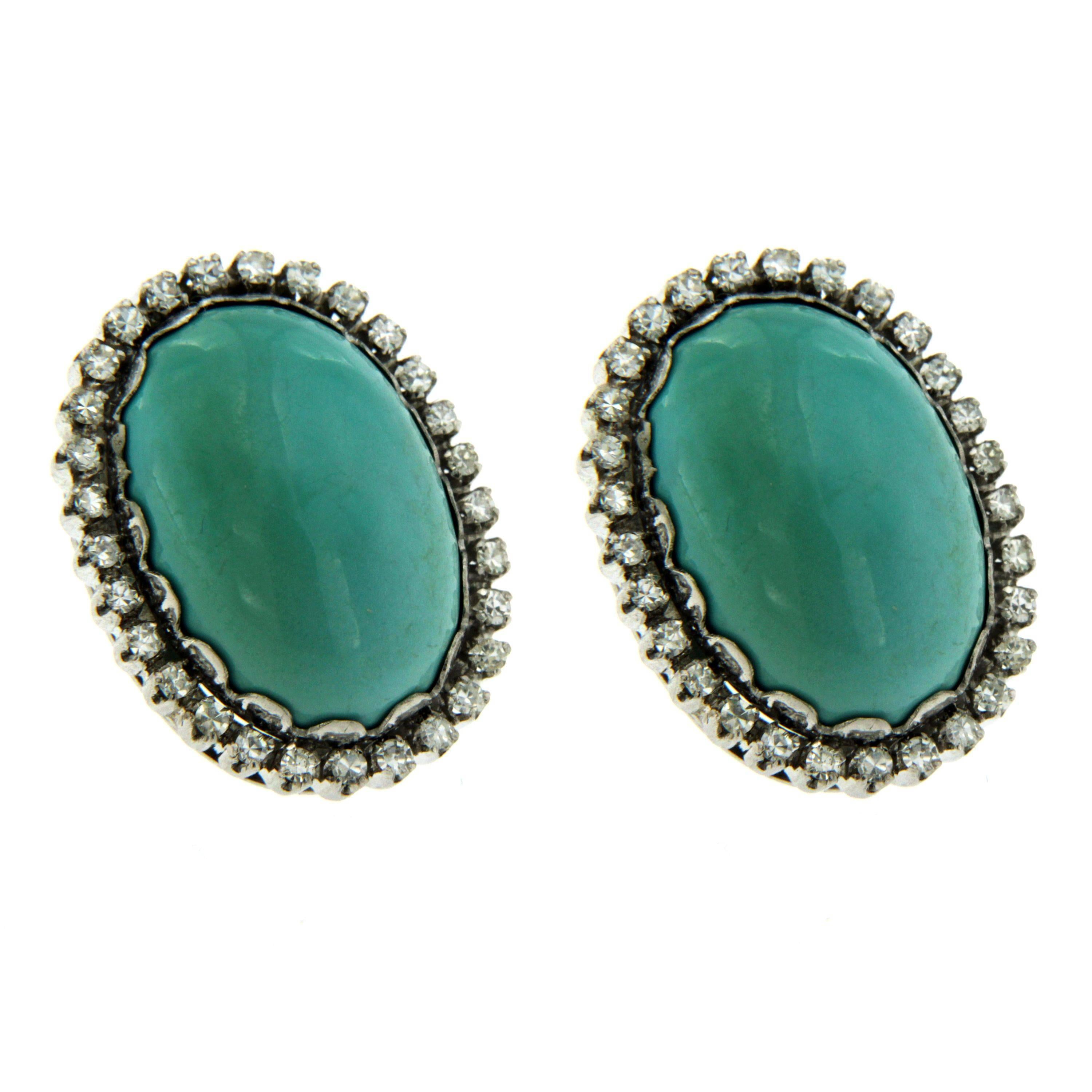 18k gold earings, decorated with natural oval Turquoise, surrounded with approximately 1.50ct in G/VS round cut diamonds. Circa 1960

CONDITION: Pre-owned - Excellent 
METAL: 18k Gold 
STONE: Diamond 1.50 total carats - Turquoise
MEASURES: height