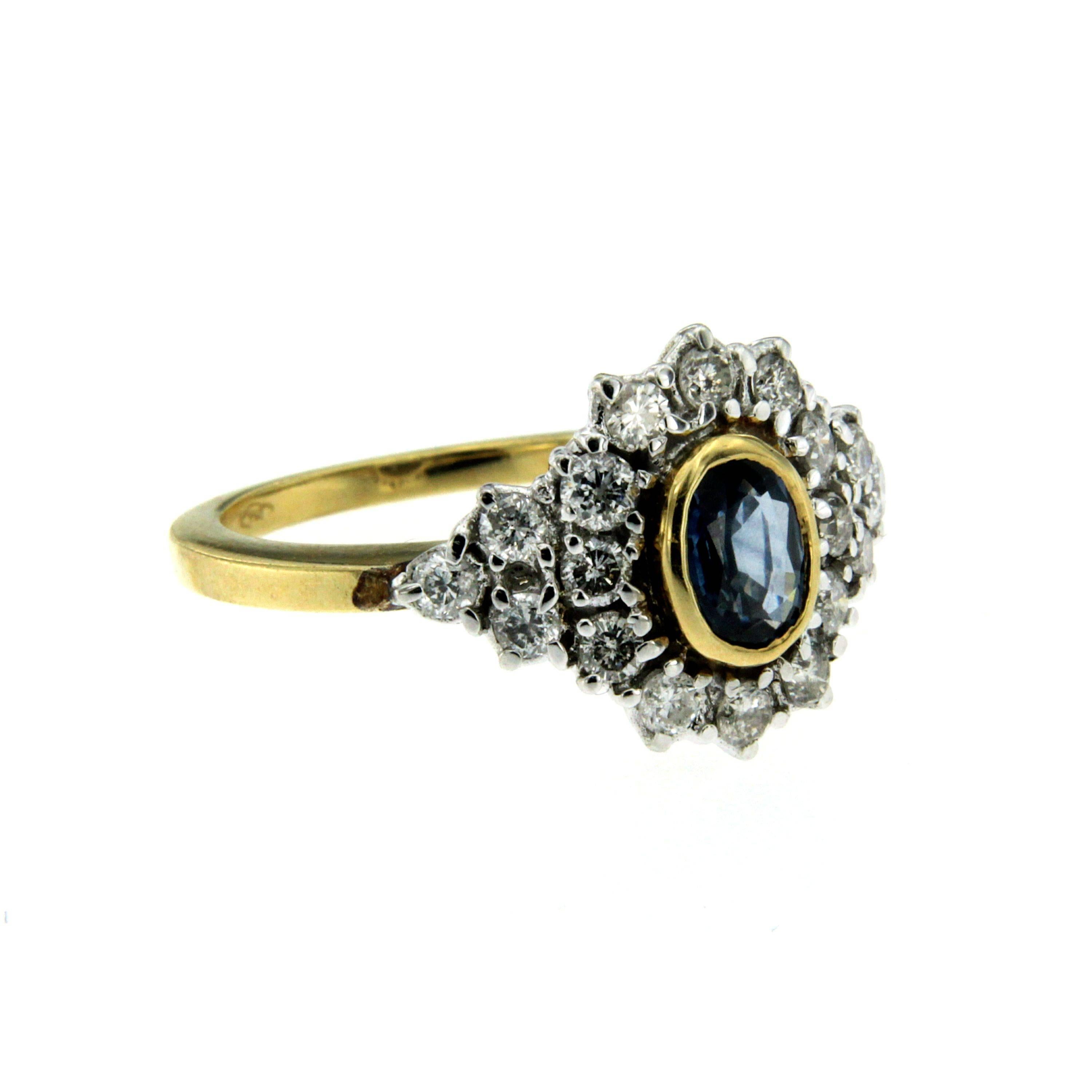 A beautiful sapphire and diamond ring, set with an oval cut Ceylon natural Sapphire, weighing approx. 1.00 ct embellished with round brilliant cut diamonds, weighing approx. total of 1.40 cts. Mounted in 18k white and yellow gold. 

CONDITION: