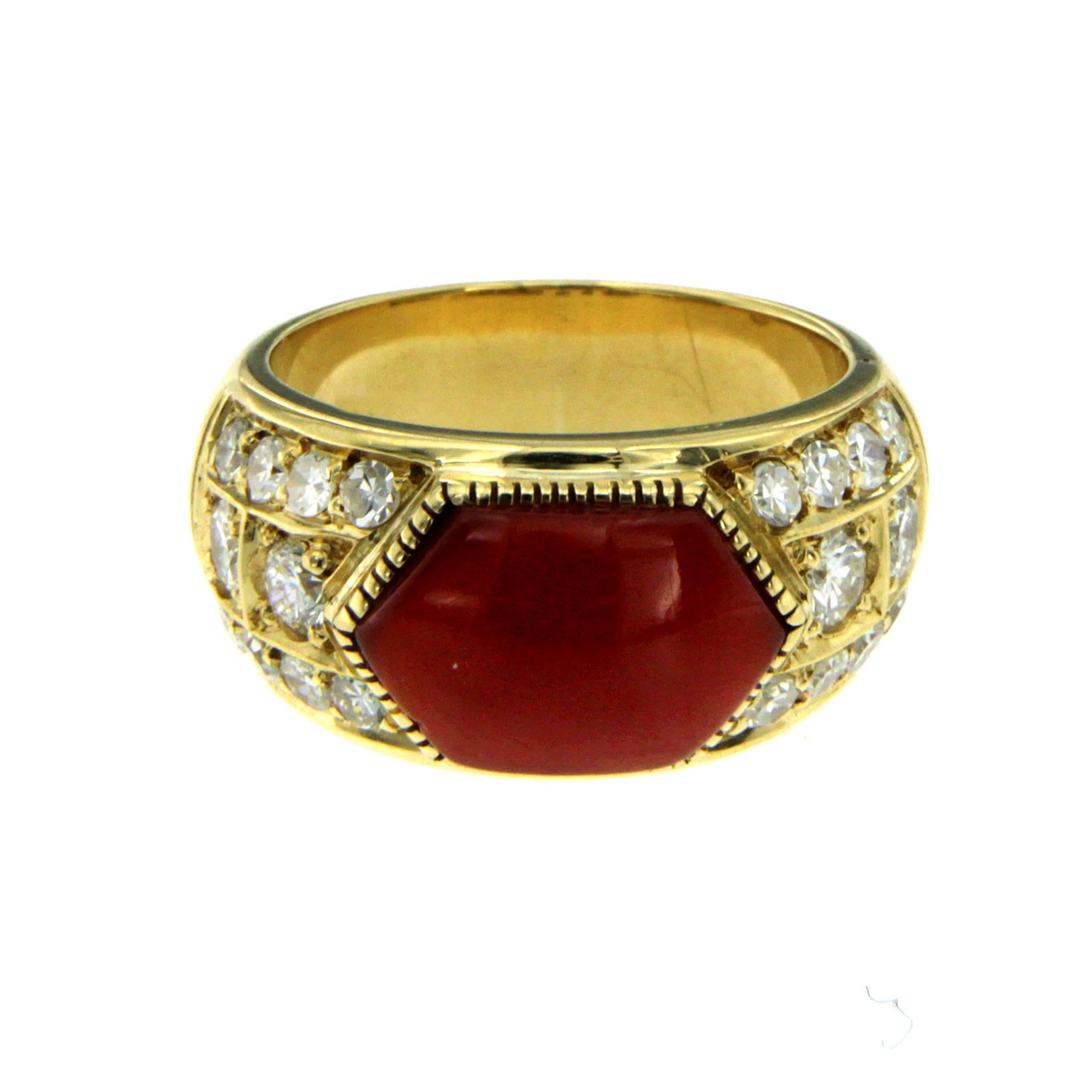 Unique coral and diamond ring featuring a natural Aka Japanese Coral of great quality and 20 round brilliant cut diamonds weighing 0.70 cts. Hand crafted of solid 18k yellow gold. Circa 1940

CONDITION: Pre-owned - Excellent 
METAL: 18k Gold 
STONE: