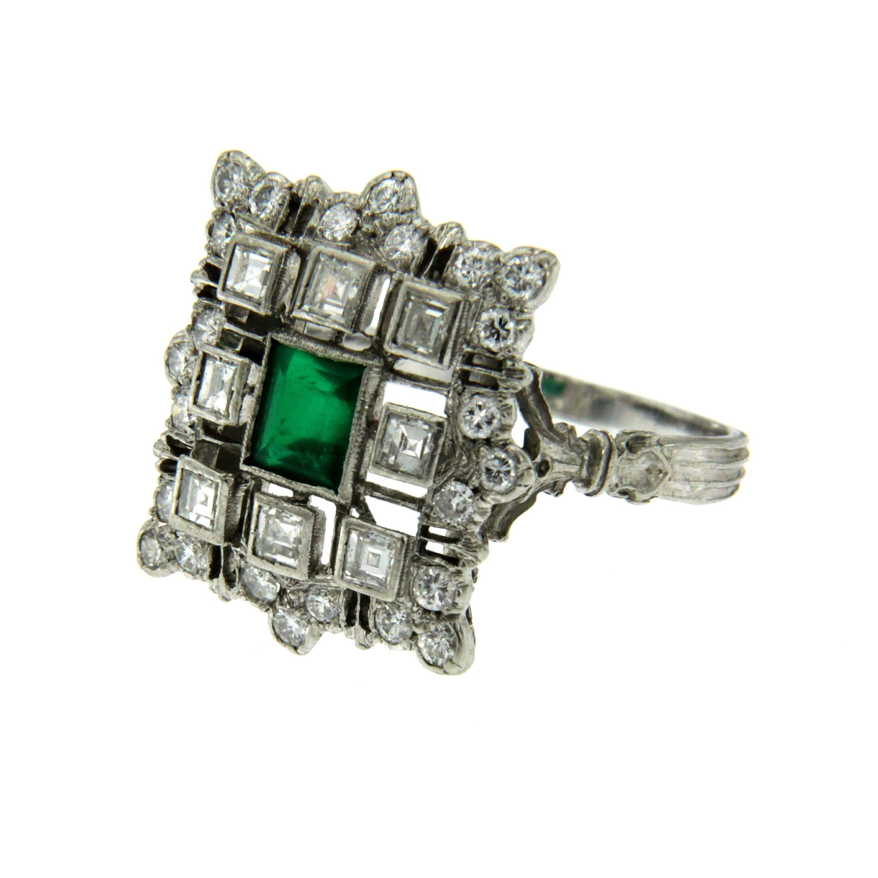 Beautiful ring from 1950, set around with 0.80 carat of round cut and square cut diamonds, graded G color Vs and in the center one emerald cut Emerald weighing approx. 0.50 carats.
This ring is designed and crafted entirely by hand in the