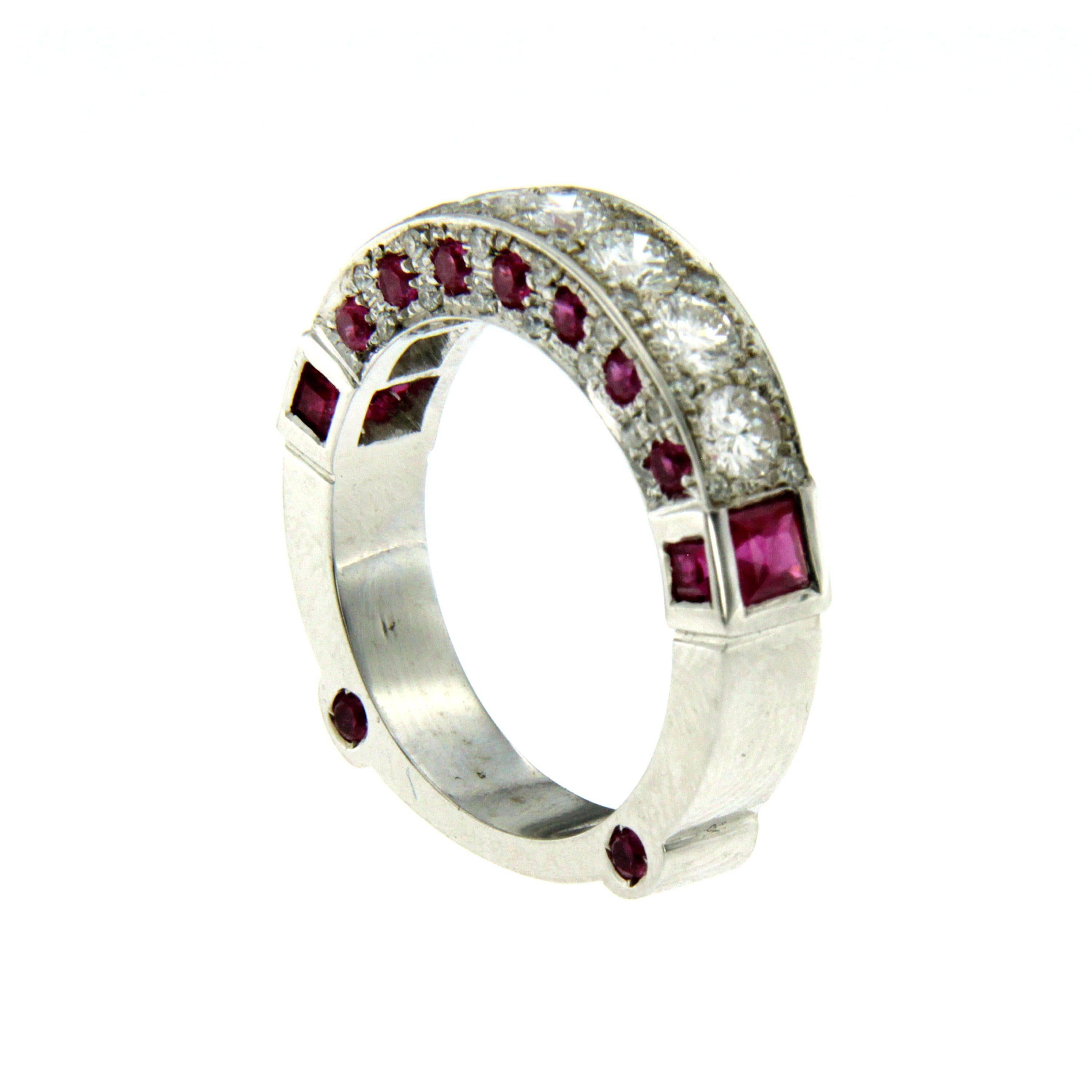 This stunning white gold band ring features round brilliant cut diamonds with a total weigh of 1.10 carats G color VVs, and 0.70 cts of fine rubies around the band's surface on both sides.

CONDITION: Brand New
METAL: 18k gold
GEM STONE: Diamond