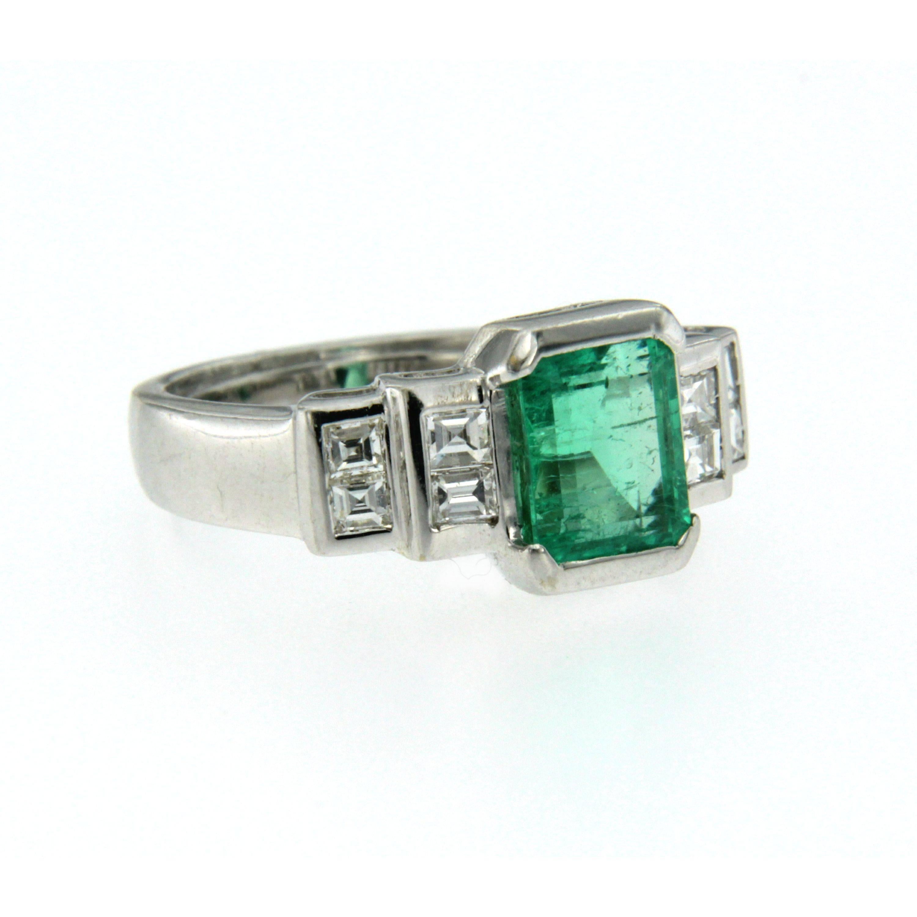 A fine and impressive 18k white Gold ring featuring a 2.20 ct Emerald-cut natural Colombian Emeral graded minor oil, free of resin tratment. Flanked on each side are baguette cut diamonds totaling 0.80 carats G color VVS clarity. Circa