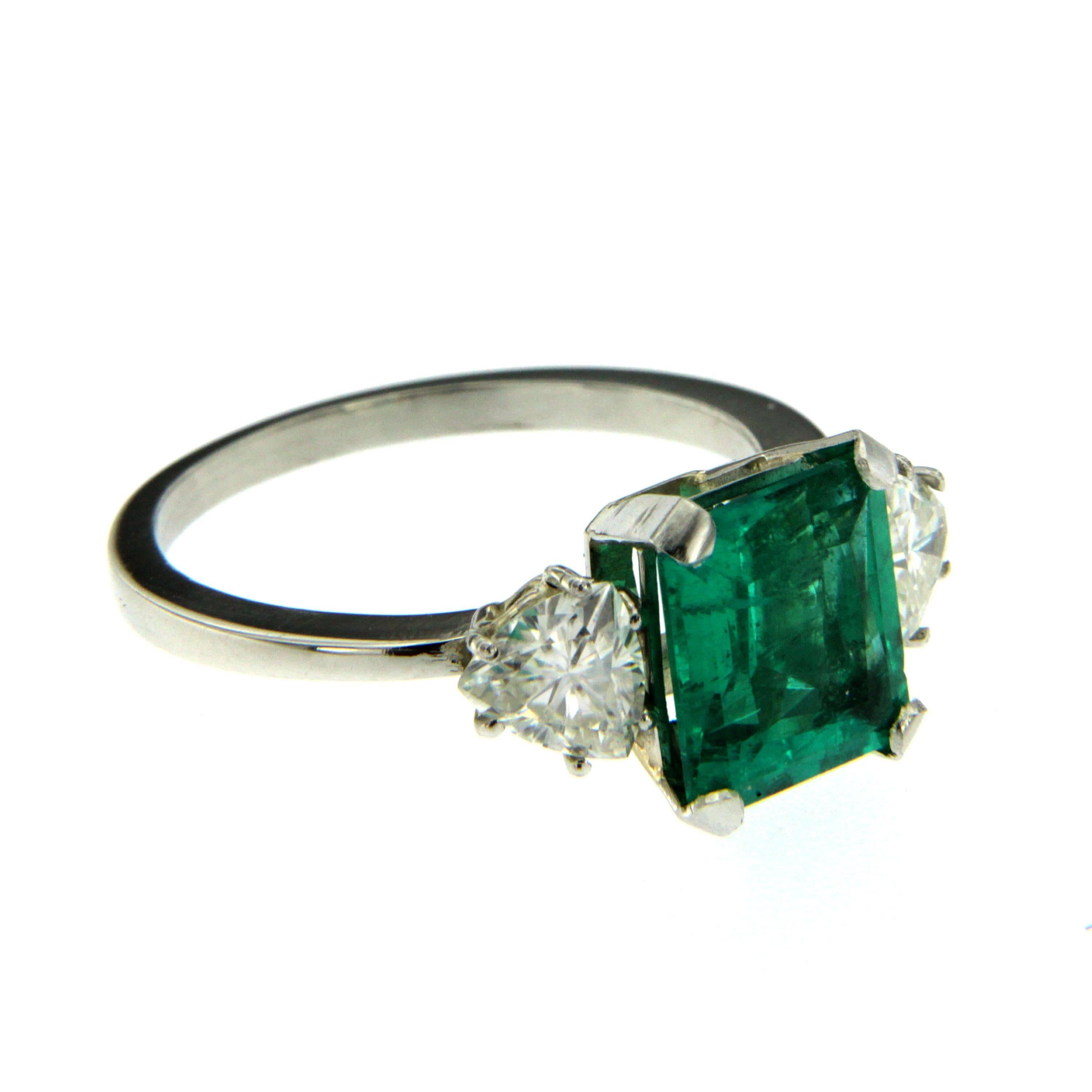 A beautiful Platinum engagement ring showcasing a natural Colombian Emerald approx. 2.75 carats of great quality, surrounded by approx. 1.00 carat of trillion cut diamonds graded H-I color Vvs.

CONDITION: Pre-owned - Excellent 
METAL: Platinum
GEM