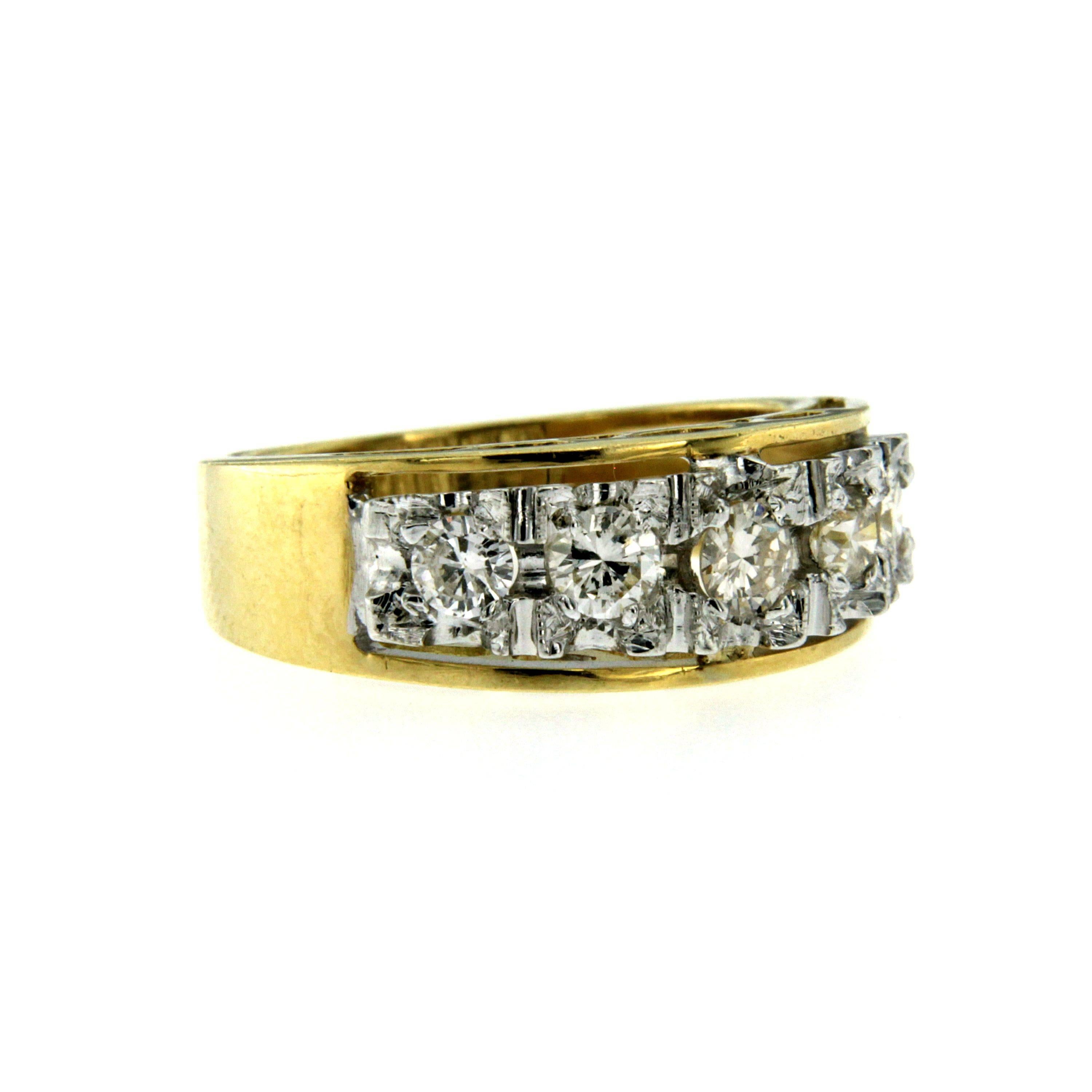 An exquisite diamond band ring set with five brilliant cut shiny and sparkly Diamonds totalling 0.75 ct. estimated to be H/I in Color and VS in clarity.
The Band is 18k yellow Gold, and the Diamonds are set in 18k white Gold. Circa 1950

CONDITION: