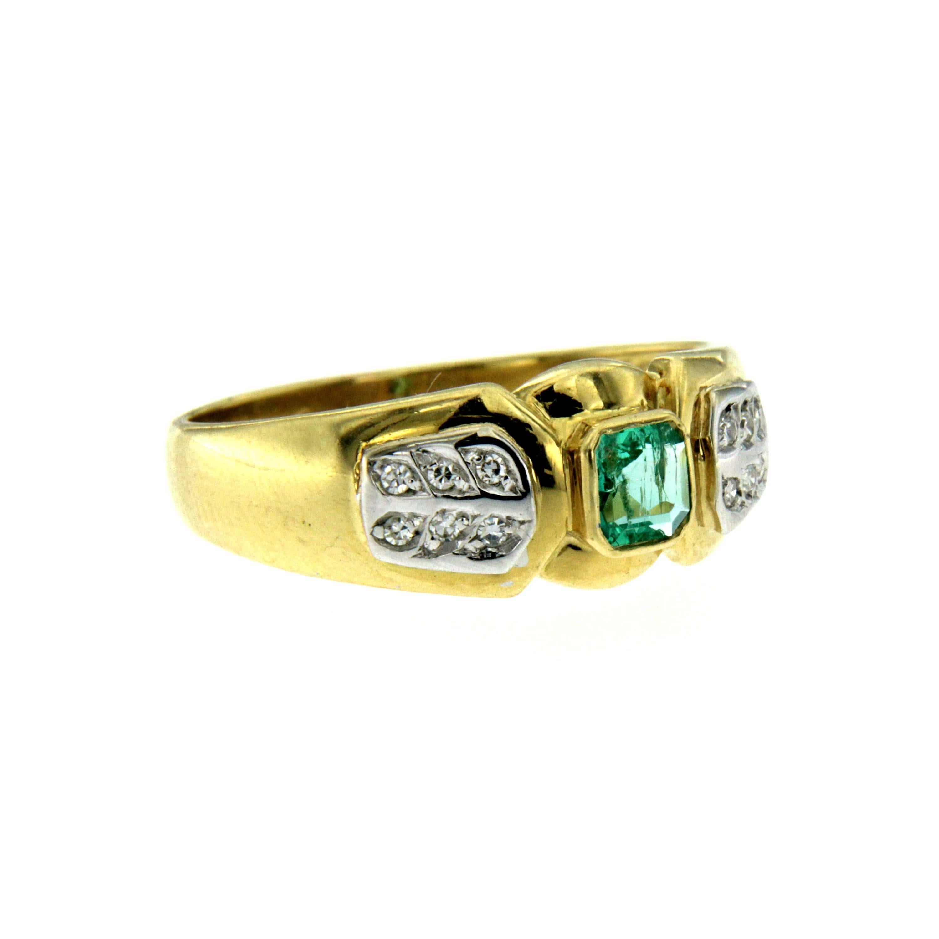 Gorgeous Retro ring handcrafted in 18k yellow gold set with a center emerald weighing 0.40 carats accented by 16 small round brilliant cut diamonds 0.12 total carats G-H color. Circa 1950

CONDITION: Pre-owned - Excellent
METAL: 18k Gold
GEM STONE:
