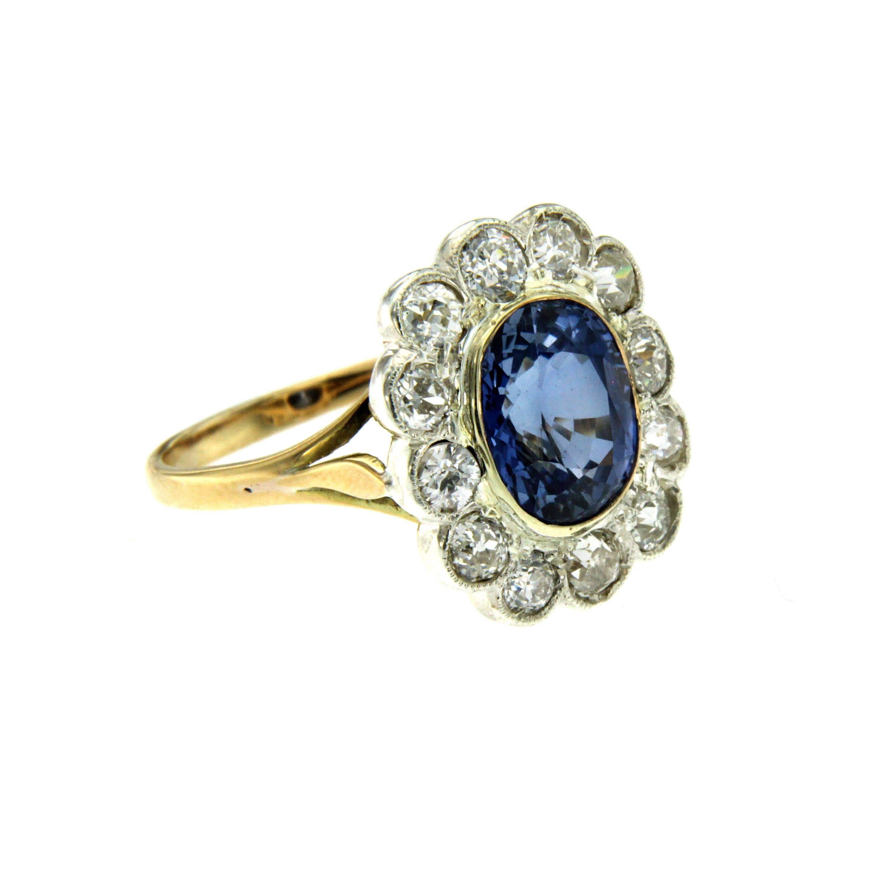 Beautiful 18k cluster ring from 1930, set around with 1,50 carat of sparkling old mine cut Diamonds, graded G/H color Vs and in the center one wide verneuil synthetic corundum weighing 5.00 cts.
This ring is designed and crafted entirely by hand in