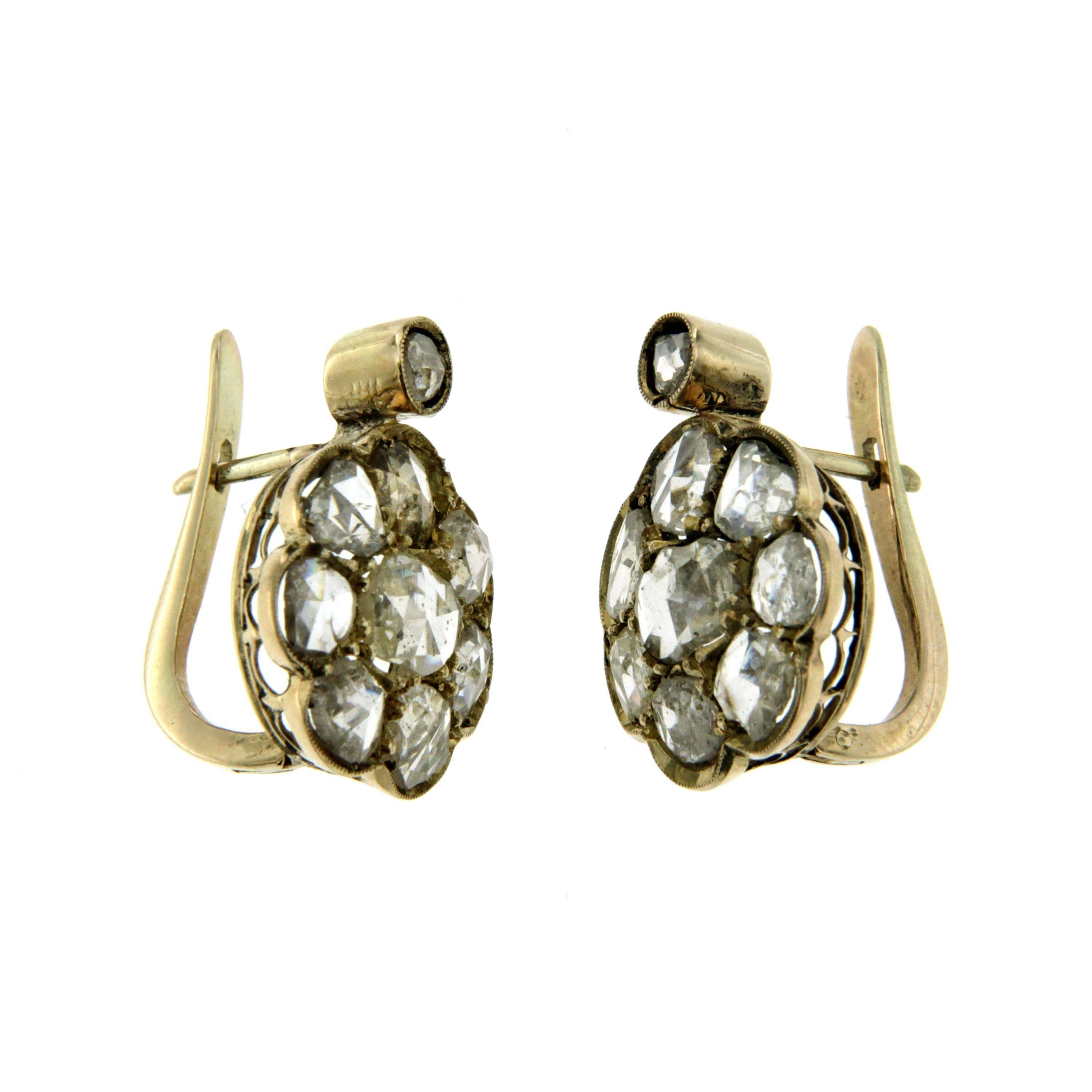 Cluster12k gold earrings authentic from 1800's period.
The Earrings are mounted with approx. 5.00 carat of rose cut Diamonds.

CONDITION: Pre-owned - Excellent 
METAL: 12k Gold 
STONE: Diamond 5.00 total carats 
DESIGN ERA: 1800s
WEIGHT: 5.70 grams