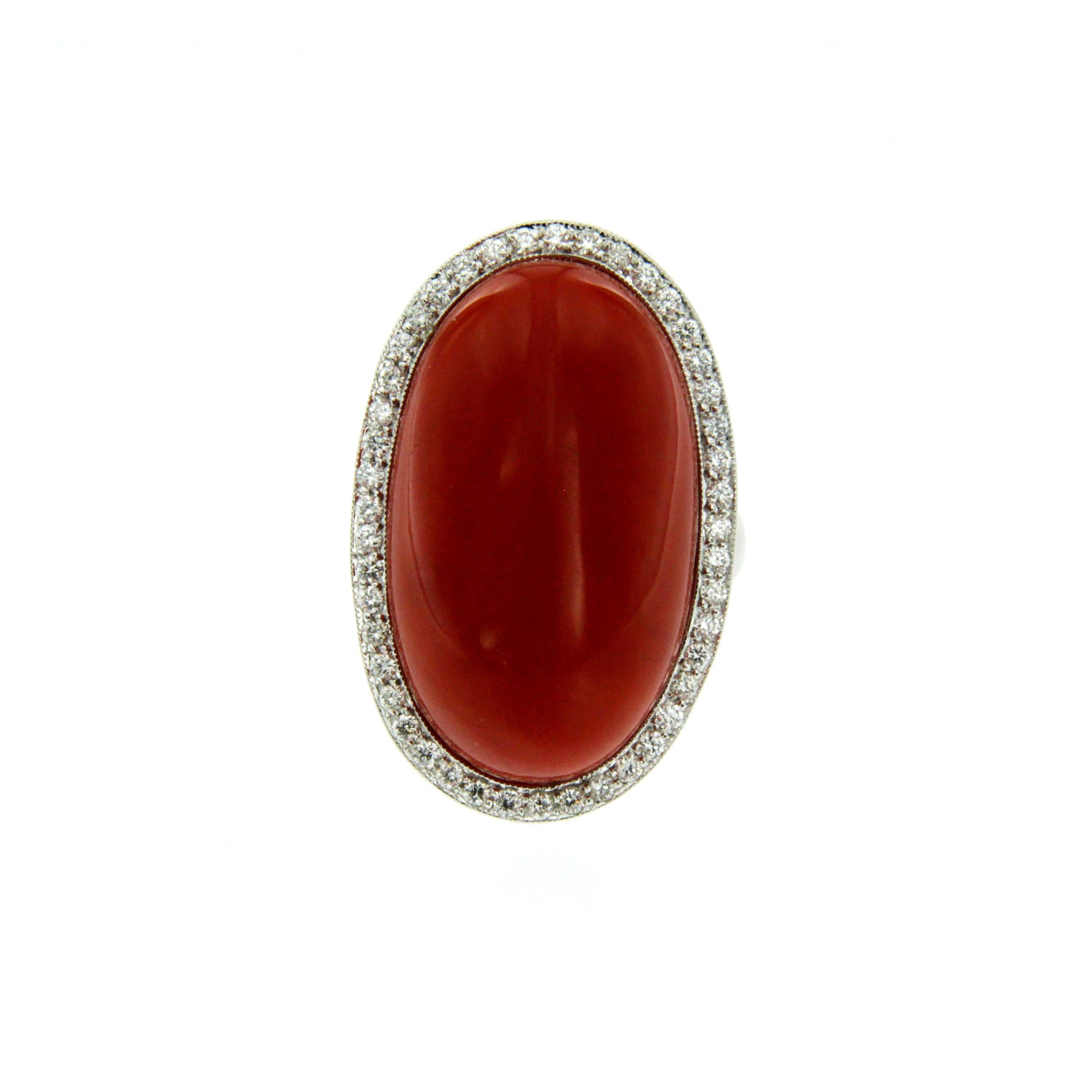 Truly exclusive vintage ring out from 1960s origin Italy, hand crafted of solid 18Kt white gold. 
The ring feautures a Natural Cabochon Aka Japanese Coral, of the greatest variety, 100% natural not dyed or worked with any resin or other synthetic