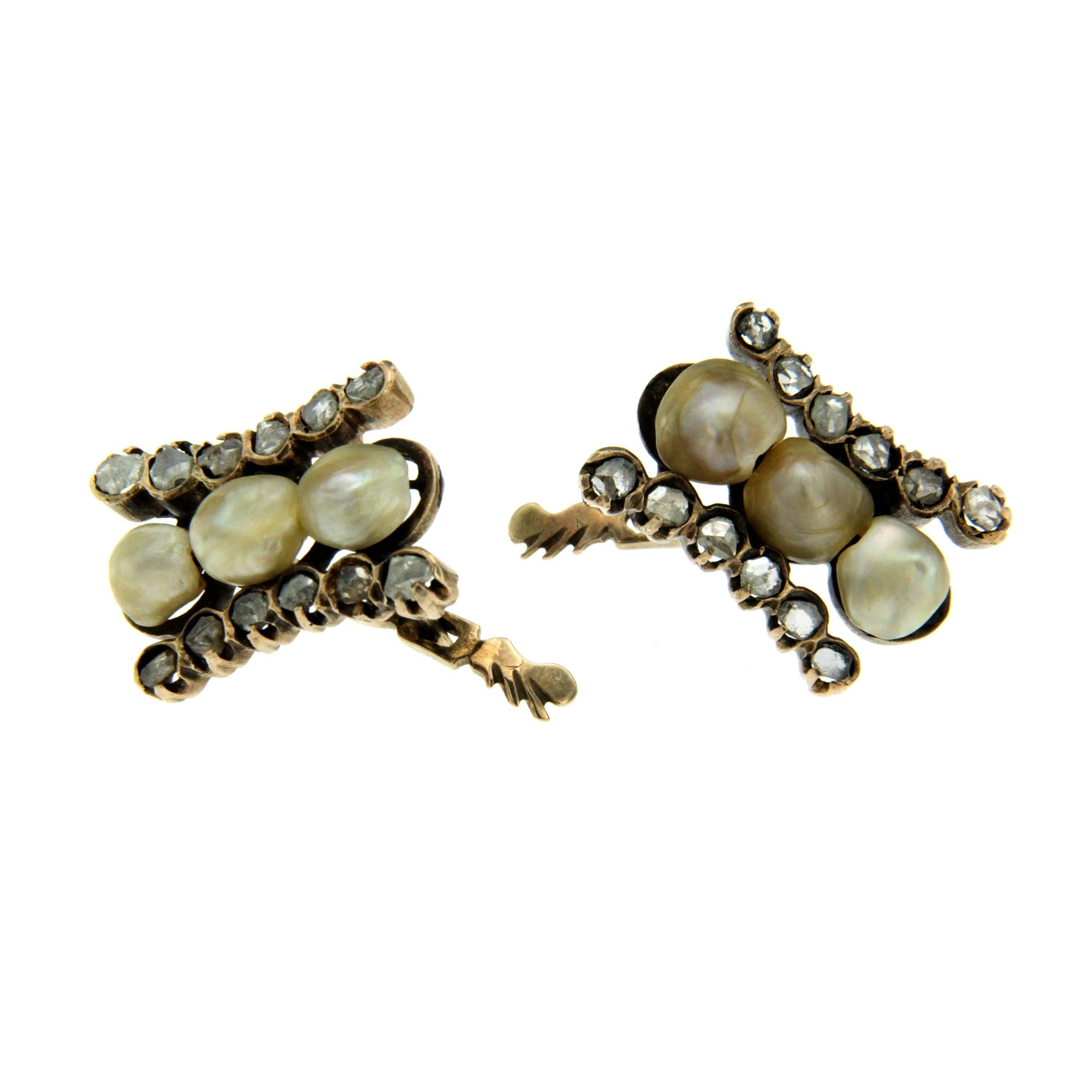 Antique 12k gold earrings authentic from 1800's period.
The Earrings are mounted with natural pearls weighing 1.50 grams and  approx. 0.40 carat of rose cut Diamonds.

CONDITION: Pre-owned - Excellent 
METAL: 12k Gold 
STONE: Diamond 0.40 total