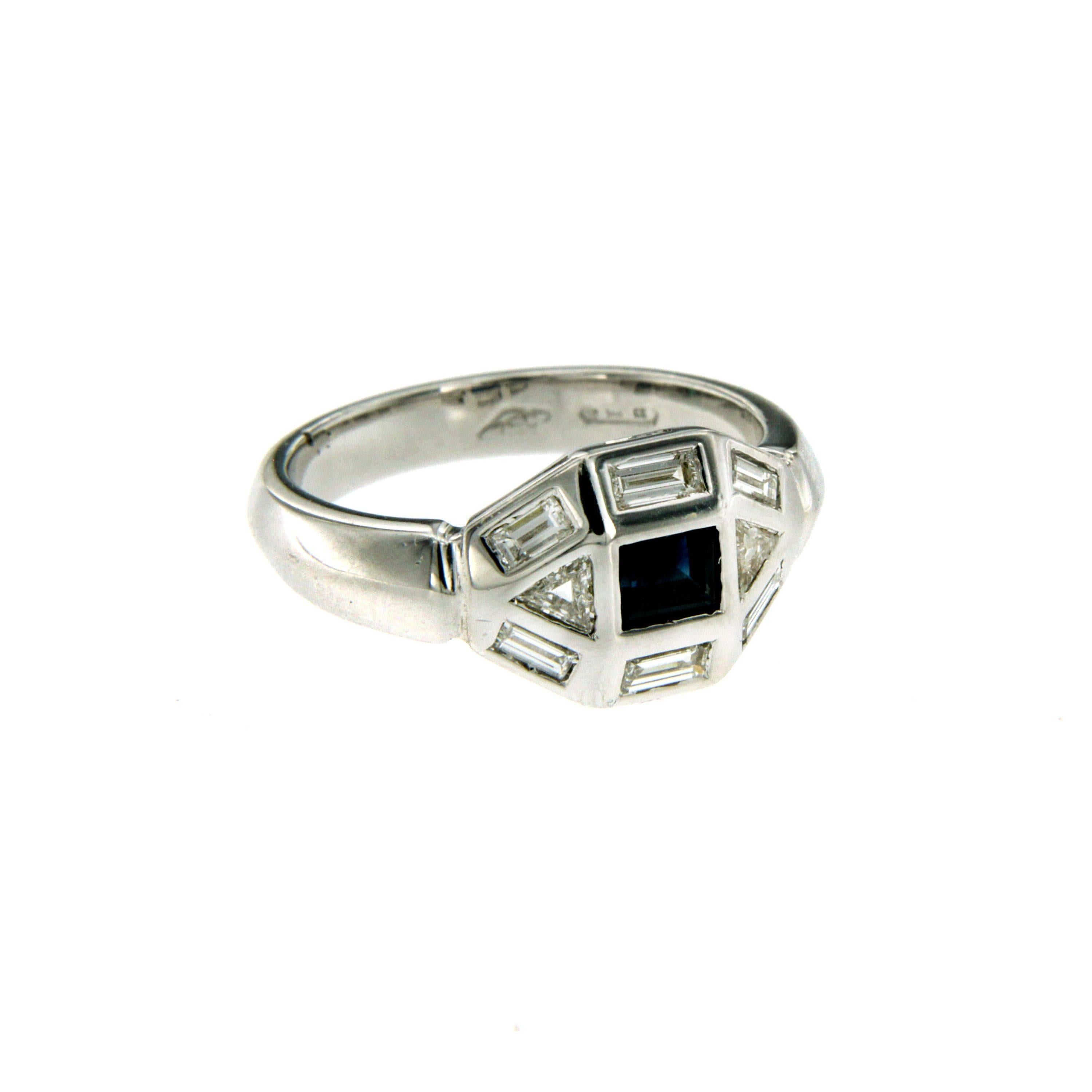 An art deco sapphire and diamond ring set in 18k gold. The ring is set with six baguette cut diamonds and two trillon diamonds framing the 0.30 ct natural sapphire. Circa 1930

CONDITION: Pre-Owned - Excellent 
METAL: 18k Gold
GEM STONE: Diamond