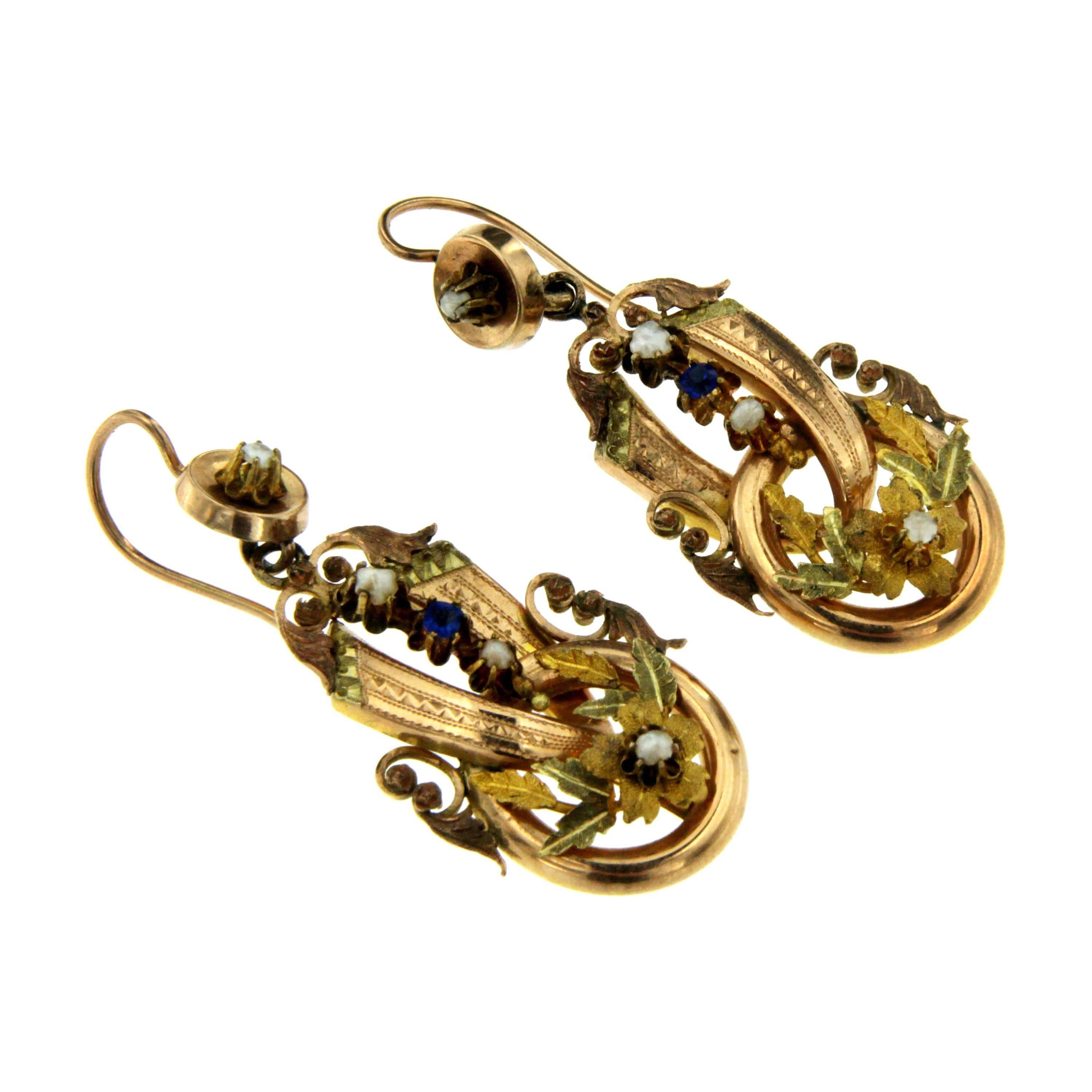 A superb pair of Neapolitan drop earrings, made circa 1800 in Naples, Italy.
These highly collectable earrings are set with two gems and pearls, Totally handcrafted in the traditional way in 12k gold, the leaves are in 22k gold. 

CONDITION: