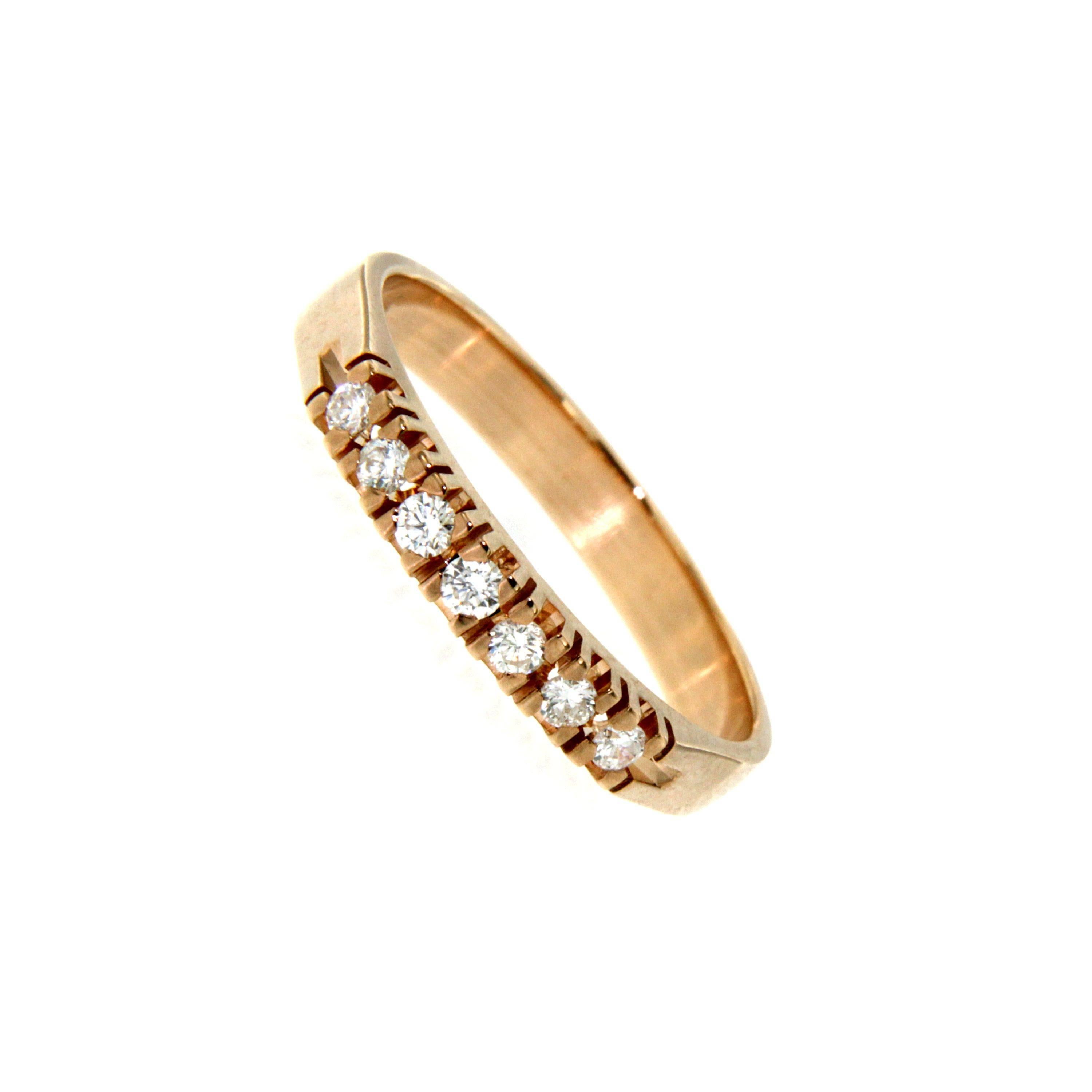 Crafted from 18k rose gold this contemporary piece is encrusted with a continuous line of 0.30 cts sparkling pavé diamonds G color Vvs clarity, along the band. Wear yours alone or stacked with other styles.

CONDITION: Brand New

METAL: 18k Rose
