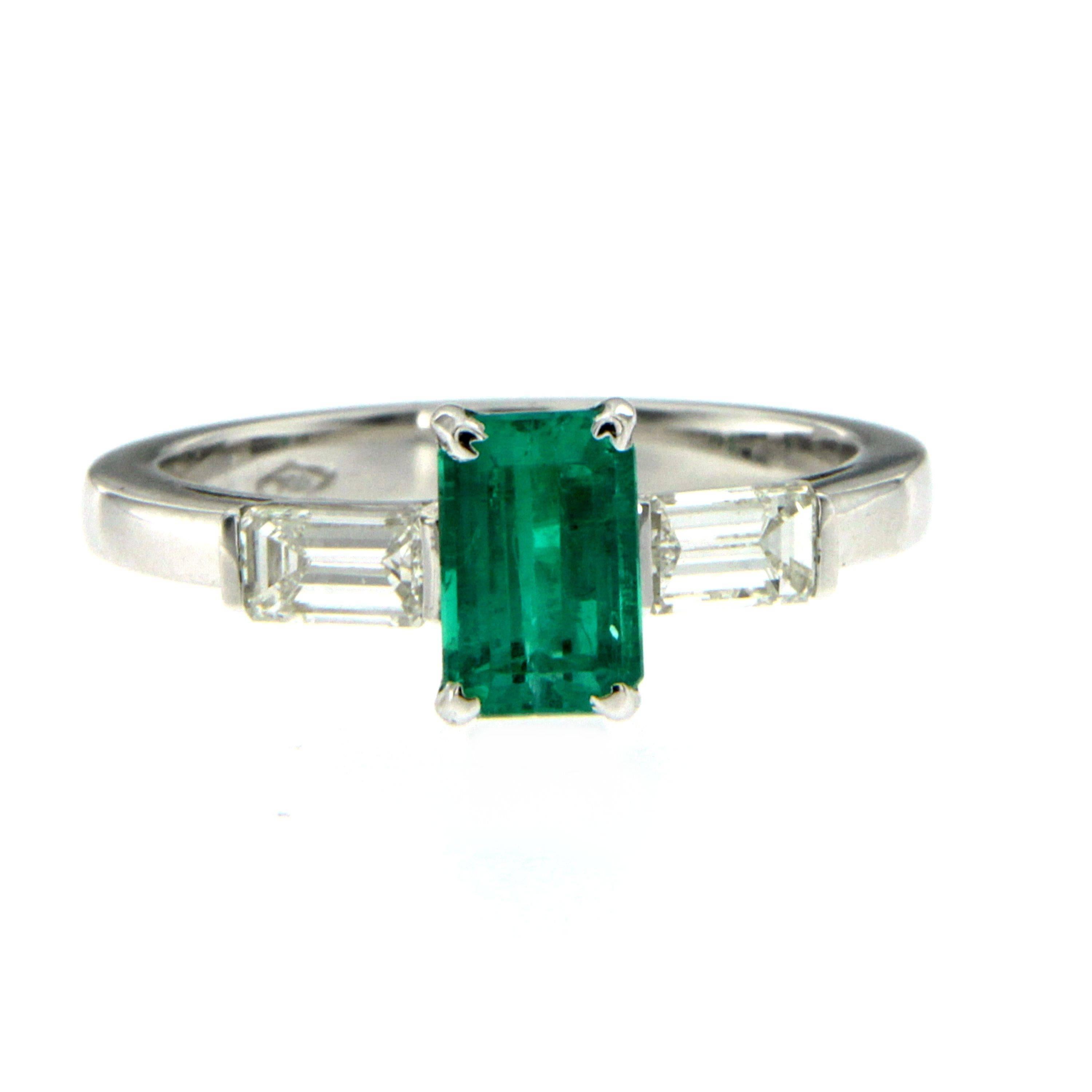 An exquisite engagement ring set in 18k white Gold featuring a 1.02 ct Emerald-cut Colombian Emerald free of any Enhancement treatment. 
Flanked on each side are baguette cut diamonds totaling 0.70 carats graded G color Vvs.

Ring Size: US 7/7.5 -