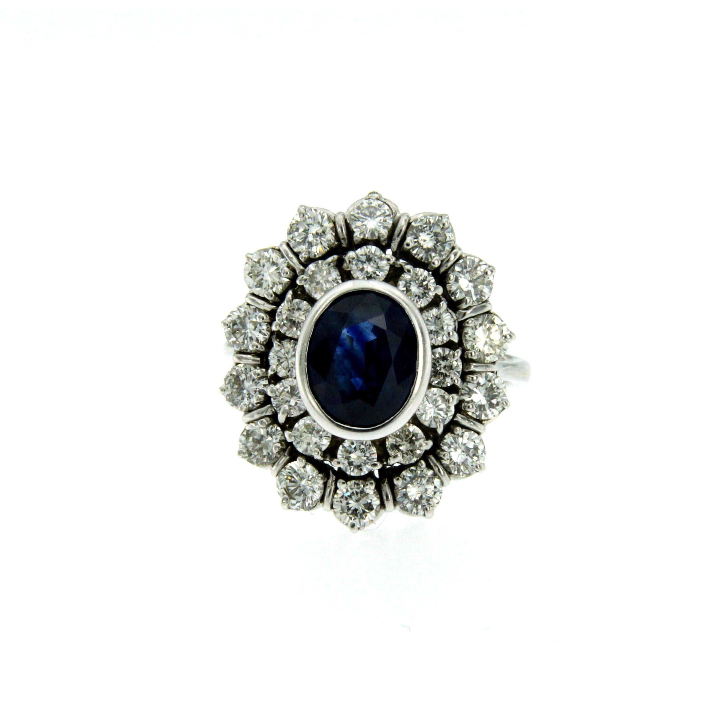 A stunning 18k white Gold, Sapphire and Diamond Ring, set in the center with an oval-cut natural Sapphire weighing 3 carats framed by a double halo consisting of 2.50 carat of round brilliant cut diamonds graded G color and Vvs clarity.
Circa