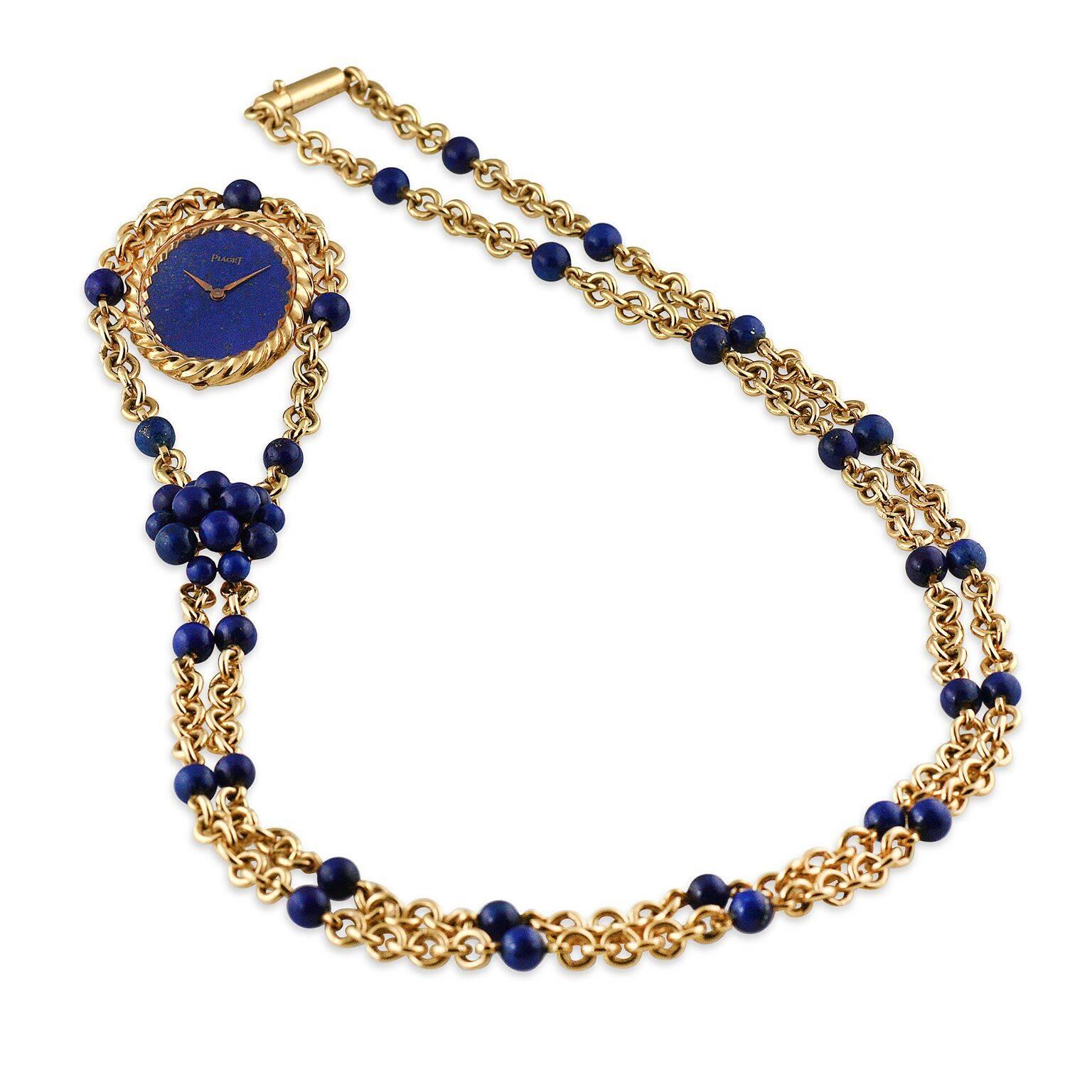 A highly elegant and unique Piaget necklace watch in 18k yellow gold with blue Lapis Lazuli beads and fitted dial. Manufactured in the early 1970's, this is an incredible piece of midcentury modern jewelry.