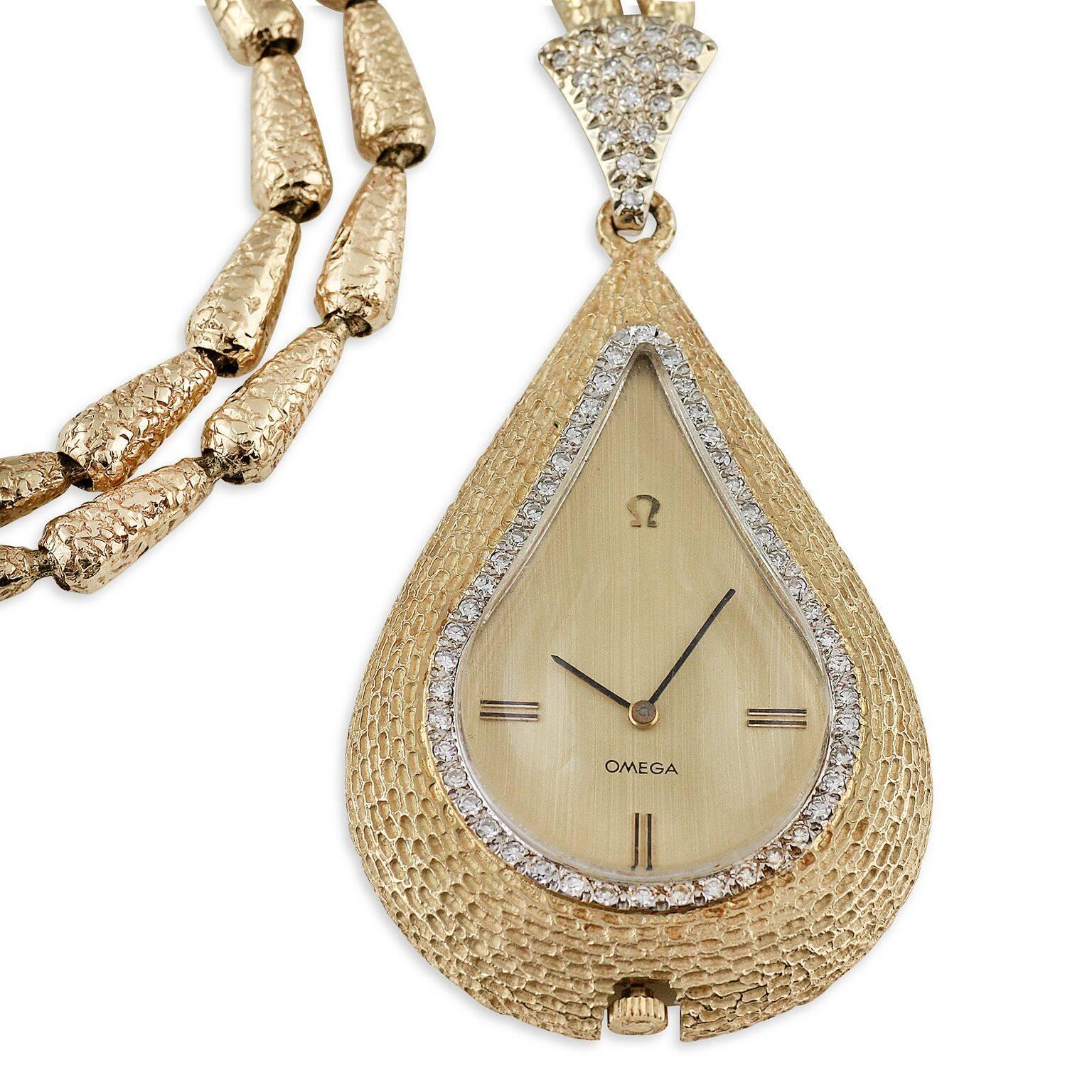 An early 1970's Omega Pendant Necklace Watch design. Hammered and textured yellow gold with diamond-set bezel. A very rare and unique piece.