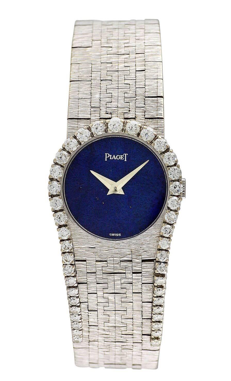 Circa 1970, this 18k white gold Piaget bracelet watch with blue lapis lazuli dial and diamond horseshoe design. Textured geometric hand-finished bracelet. An elegant and rare lady's jewelry watch.

Mechanical Movement. 