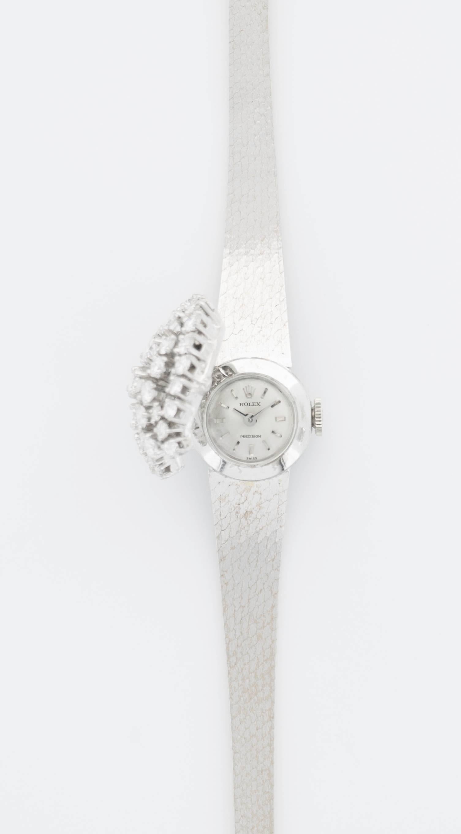 A very rare and unusual Diamond Cover Watch by Rolex. Beautiful design from the 1960's. A petite and classic cocktail watch.

Mechanical Movement. 