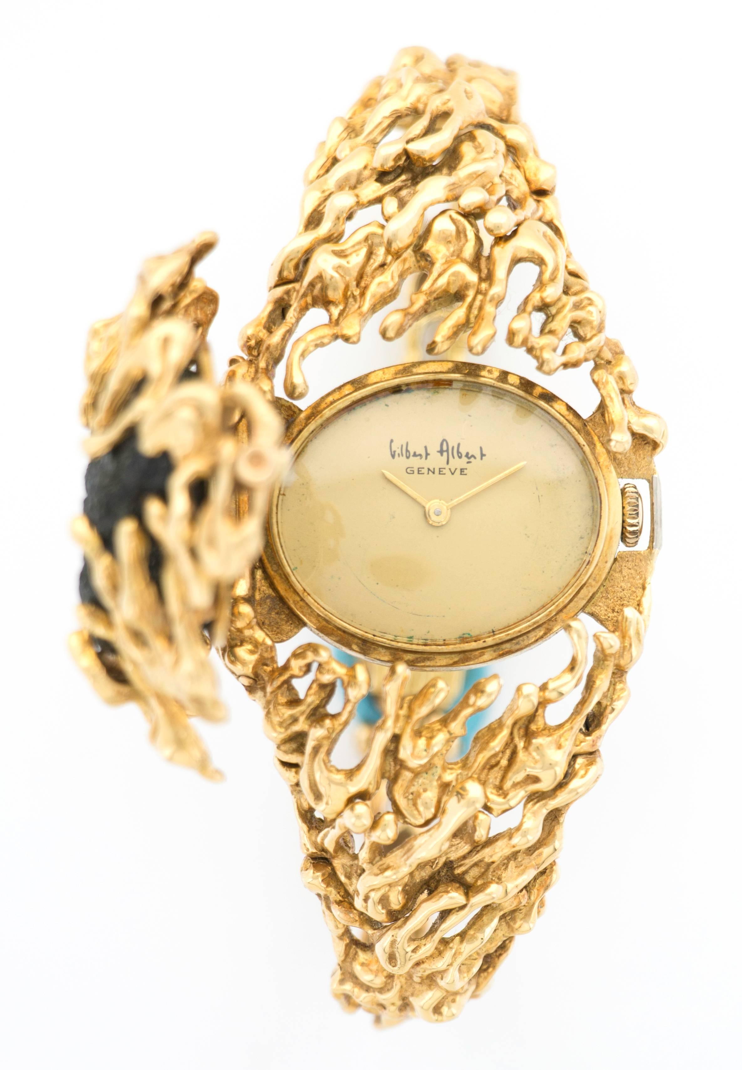 An incredibly rare and extraordinary yellow gold bracelet watch by esteemed jewelry designer Gilbert Albert. Known to create some of the most unique and creative pieces for Patek Philippe, Omega and his own jewelry company. Completely unique