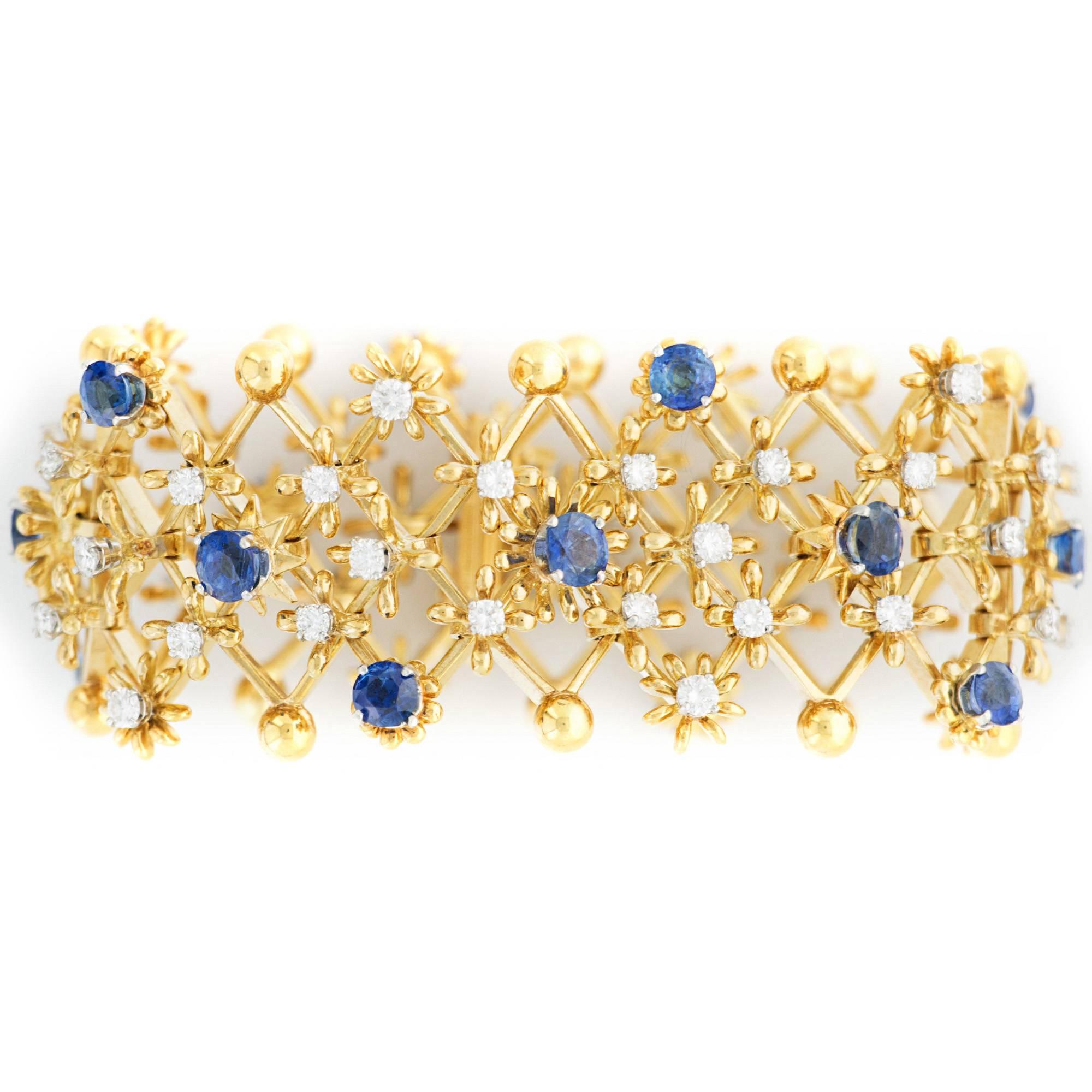An absolutely beautiful flexible and wide bracelet composed of cross links with Sapphire and Diamond segments. Signed Tiffany Schlumberger 18k. 

Circa late 1960's.