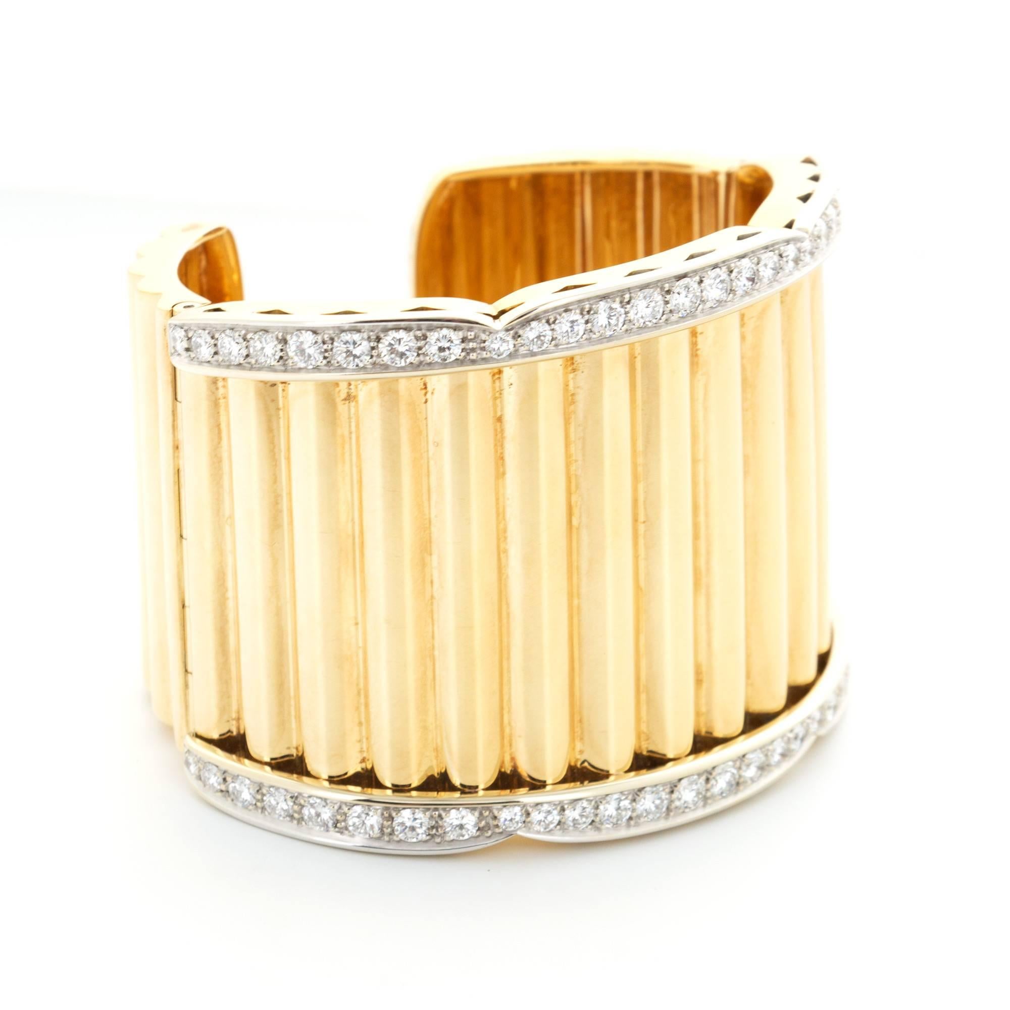 A Van Cleef & Arpels Wide Diamond-Set Cuff Bracelet in 18k Yellow Gold. 

Circa 1960's.

Very Rare and Unusual Design.