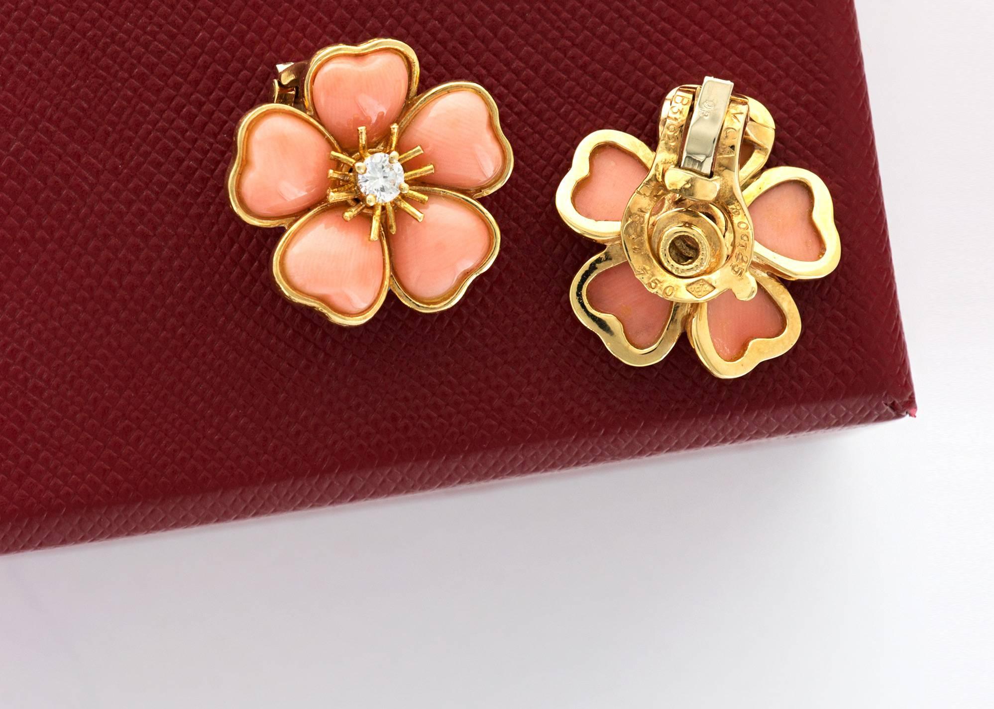 A Pair of Van Cleef & Arpels Coral and Diamond Flower Earrings. 

Circa 1970's.

 Excellent original condition.

Stamped with VCA Signature, Hallmarked and Numbered.
