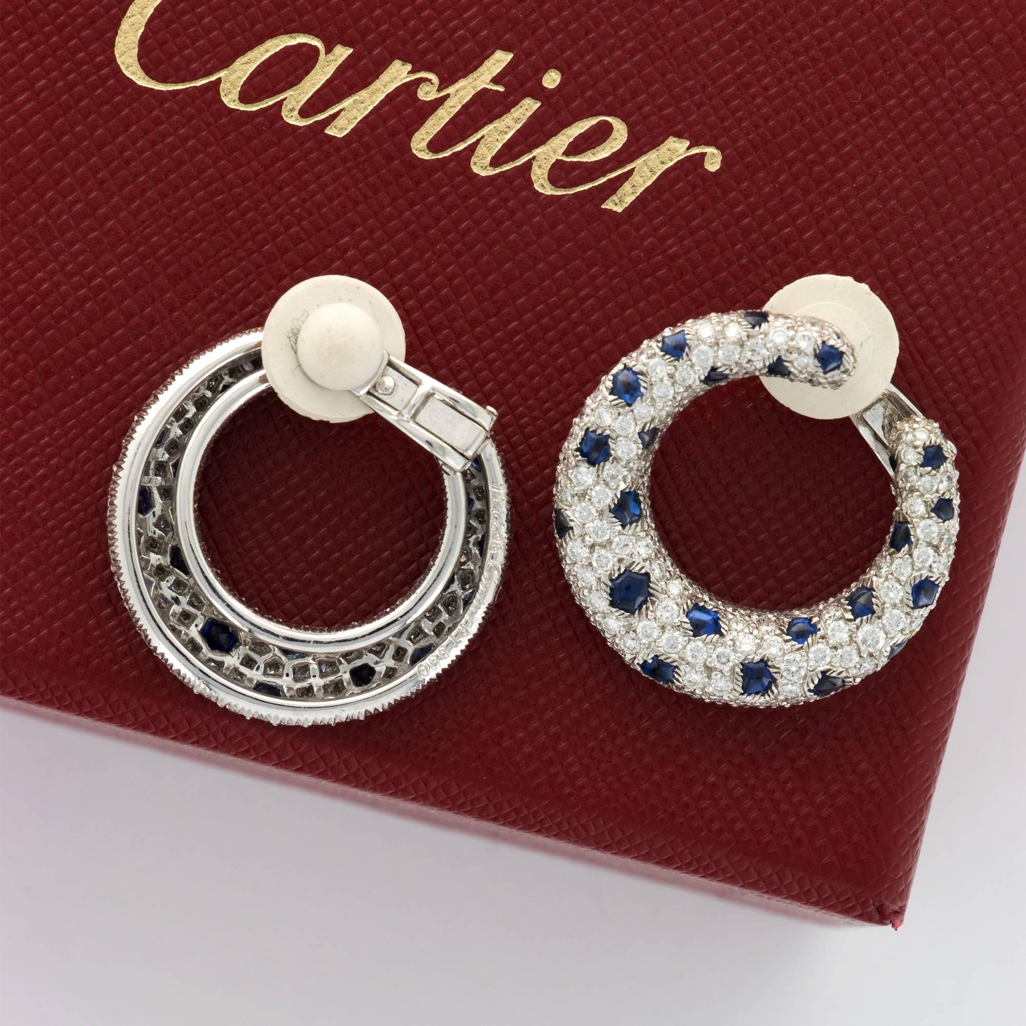 An Extraordinary Pair of "Panthere de Cartier" Earrings with Sapphire & Diamonds set in Platinum. Approximately 8.83 carats of diamonds and 4.00 Carats of Blue Sapphires. Earrings Weigh 22.4 grams. Signed Cartier.
