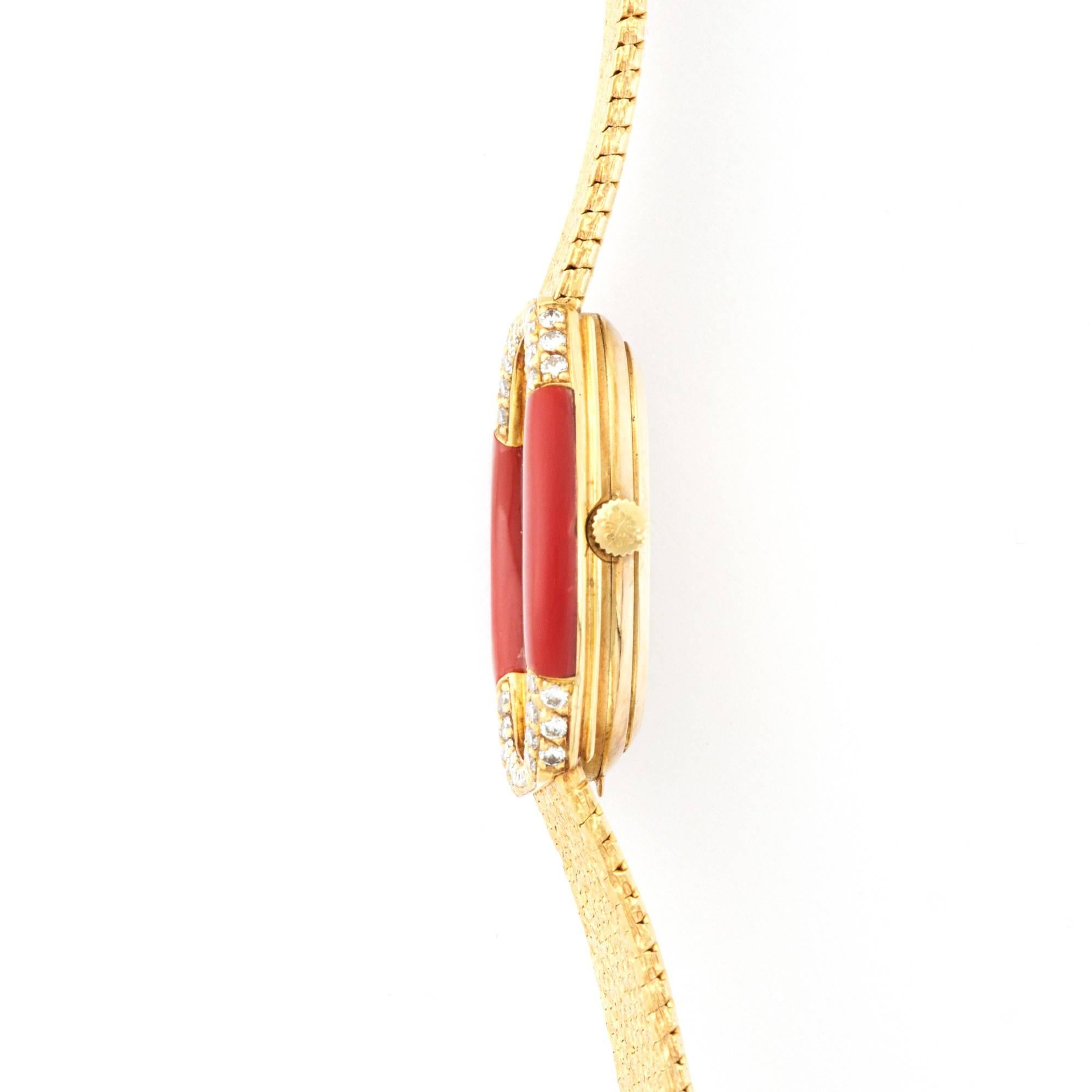A  Yellow Gold Bracelet Watch with Red Coral, Onyx, and Diamonds, by Patek Philippe. Amazing Period Design. All Original.

Manual Wind Movement.

Patek Philippe Ref. 4362/1

Circa 1970's