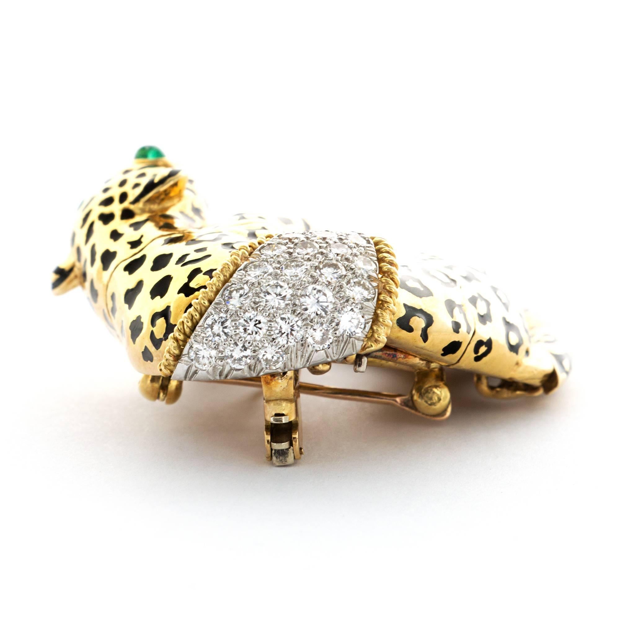 A Stunning Draped Panther Brooch in 18k Yellow Gold. Black Enamel, Diamonds, and Emeralds. Stamped with Makers Mark, "WEBB".

