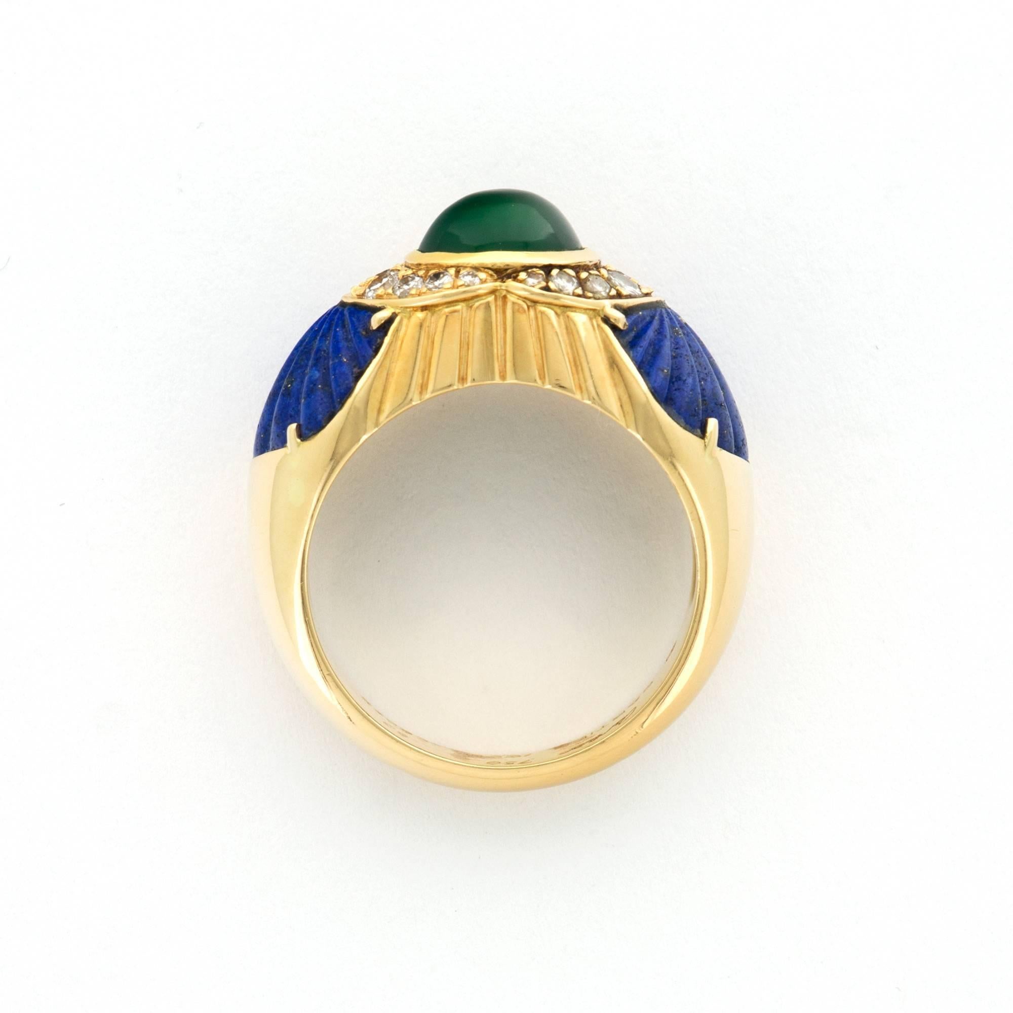A Beautiful 18k Yellow Gold Cabochon Emerald Dome Ring with Lapis and Diamonds, By Cartier. Made in France. Size 53. Circa 1990.