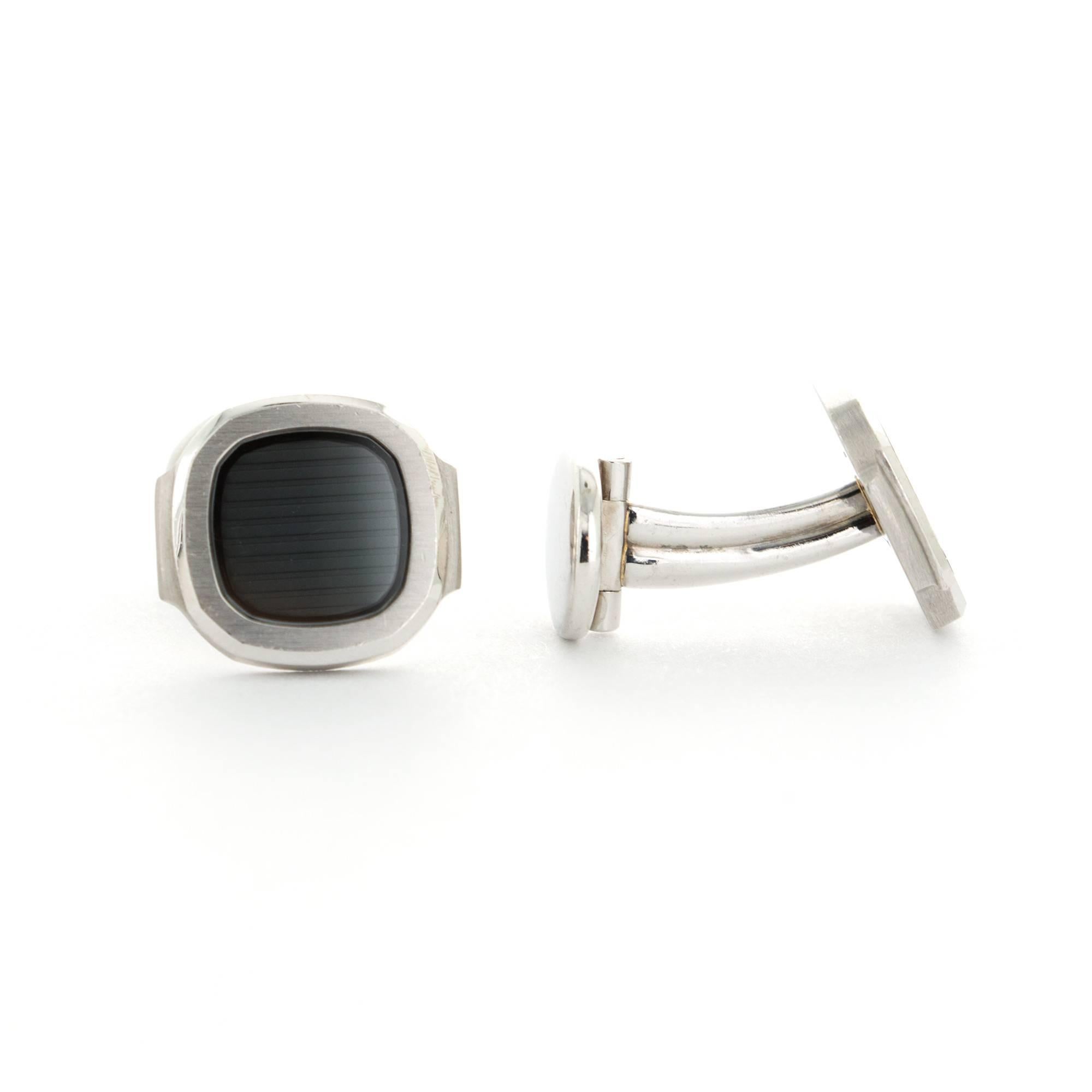 A Pair of 18k White Gold Cufflinks by Patek Philippe from the Nautilus Collection. Signed 