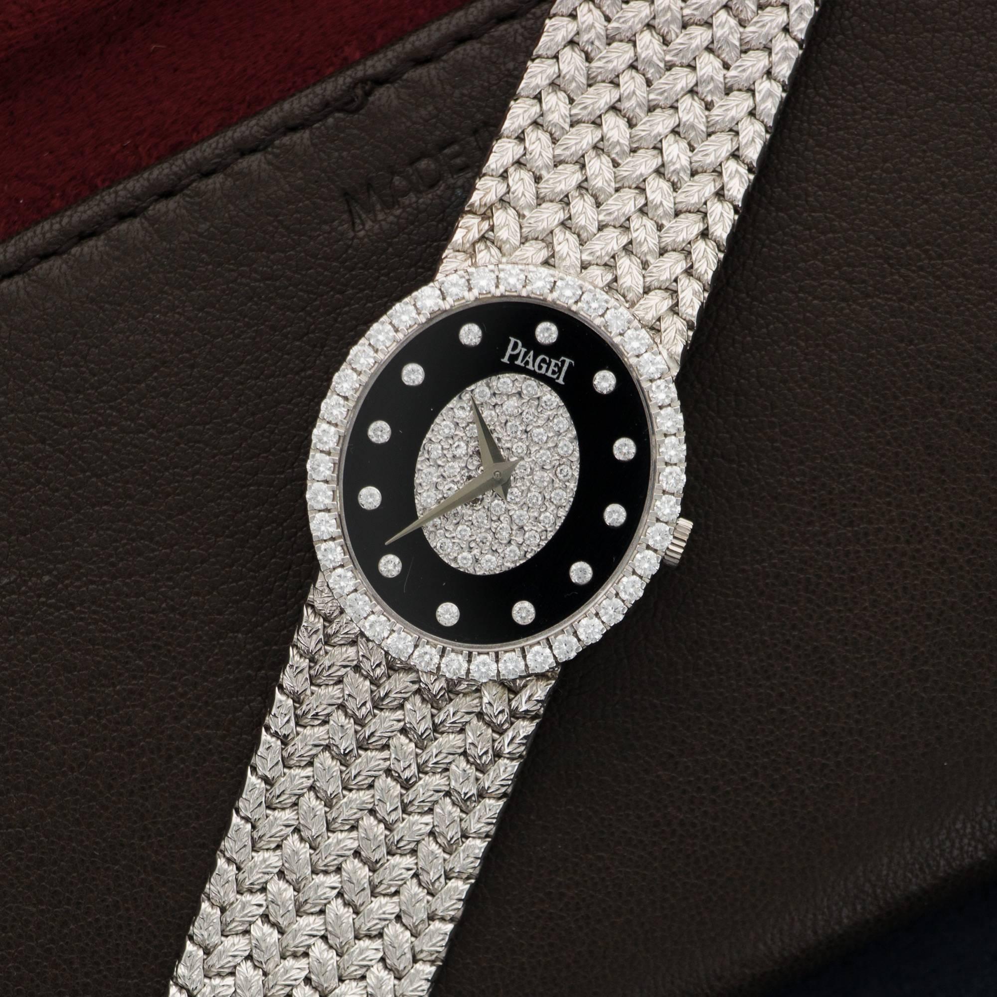 An 18k White Gold Pave Diamond & Onyx Bracelet Watch. Model 9826. Circa 1970's. Mechanical Wind. Case size 24.2mm X 27.2mm. 