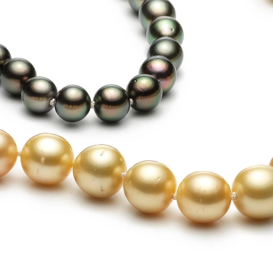 Pearl Necklace consisting of 22 yellow-gold South Sea Pearls and 46 grey Tahiti Pearls and 25 white South Sea Pearls. The length of the string is 85cm.