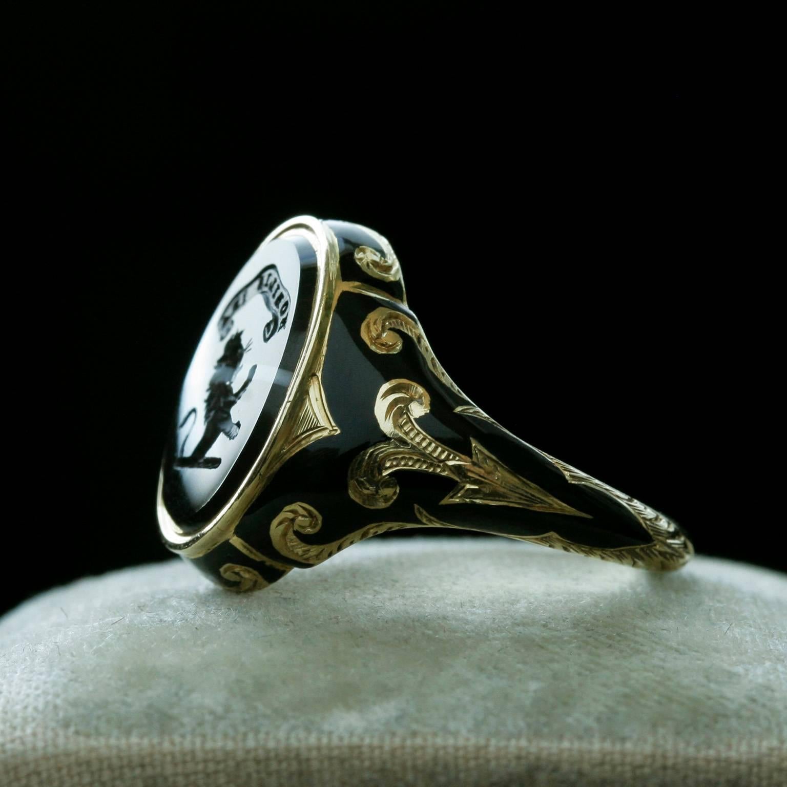 An exceptional Victorian 'Bishop of Lincoln' ring. The banded agate has a carved 'leaping lion' with the words of 'MOBILIS IRA'; Leaping lion traditionally symbolizes strength, bravery and nobility.  A lion also symbolizes the power of God and