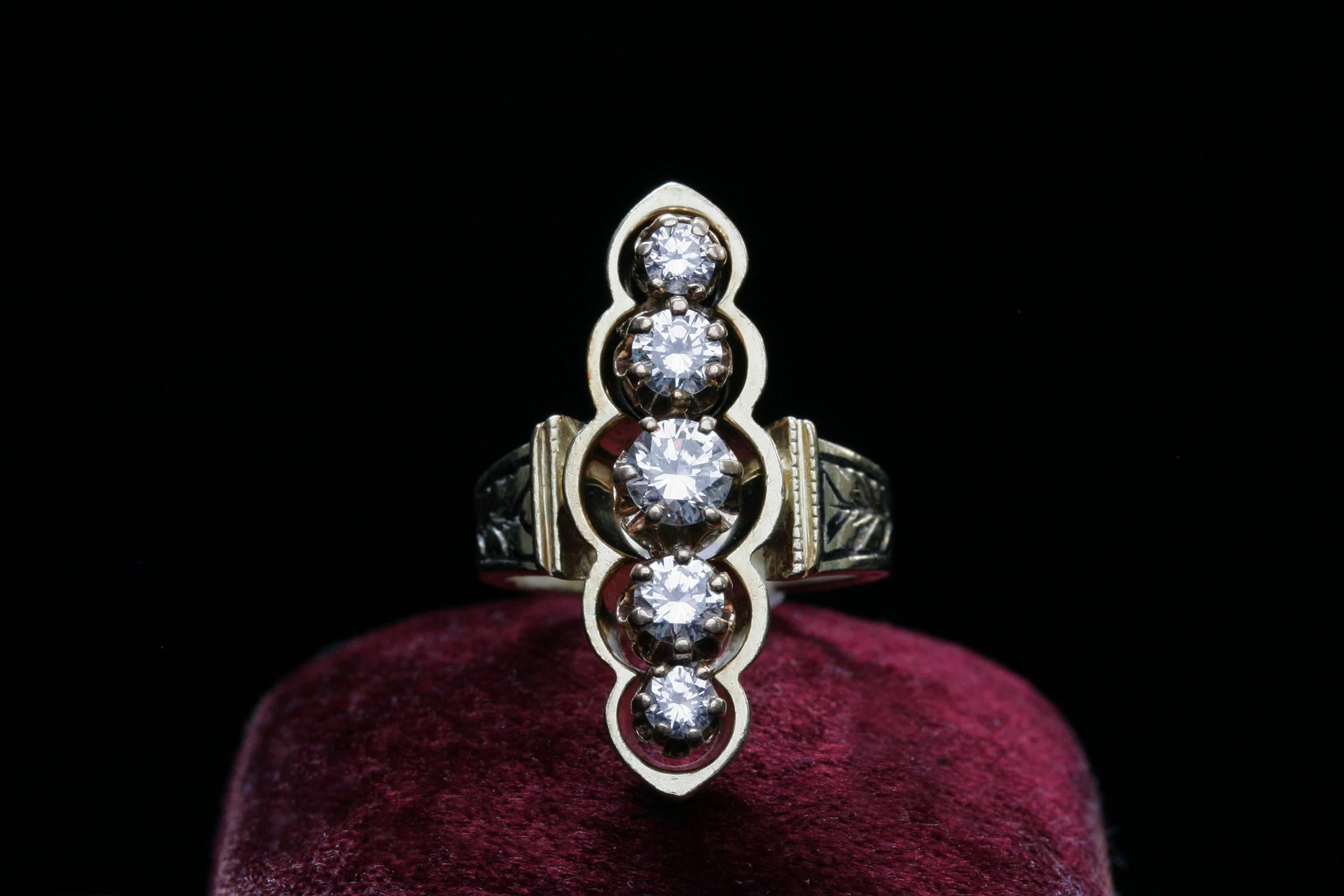 A beautiful five fine brilliant-cut diamonds (approximately .68ct) Navette ring. The ring is 14k gold, and It is engraved and black-enameled on the shoulder. A mid 20th century piece.

US size: 2 1/2 (resizable)
N to S: Approximately