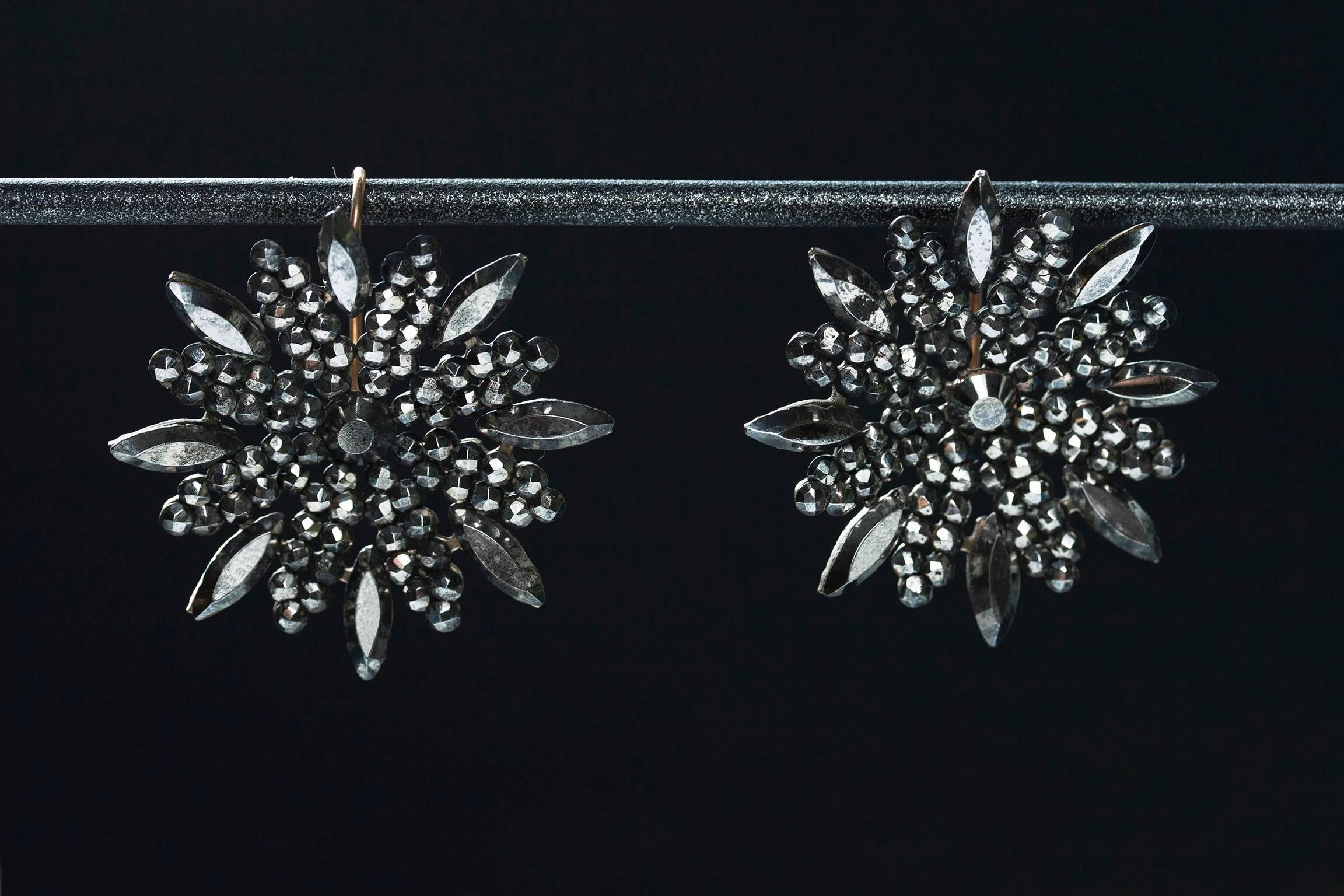 C.1870. A beautiful pair of Victorian cut steel earrings of ‘snowflake’ motif. Cut steel jewelry was introduced in the Georgian era around the mid-1700s. This particular type of jewelry is made with polished steel-faceted studs to create a