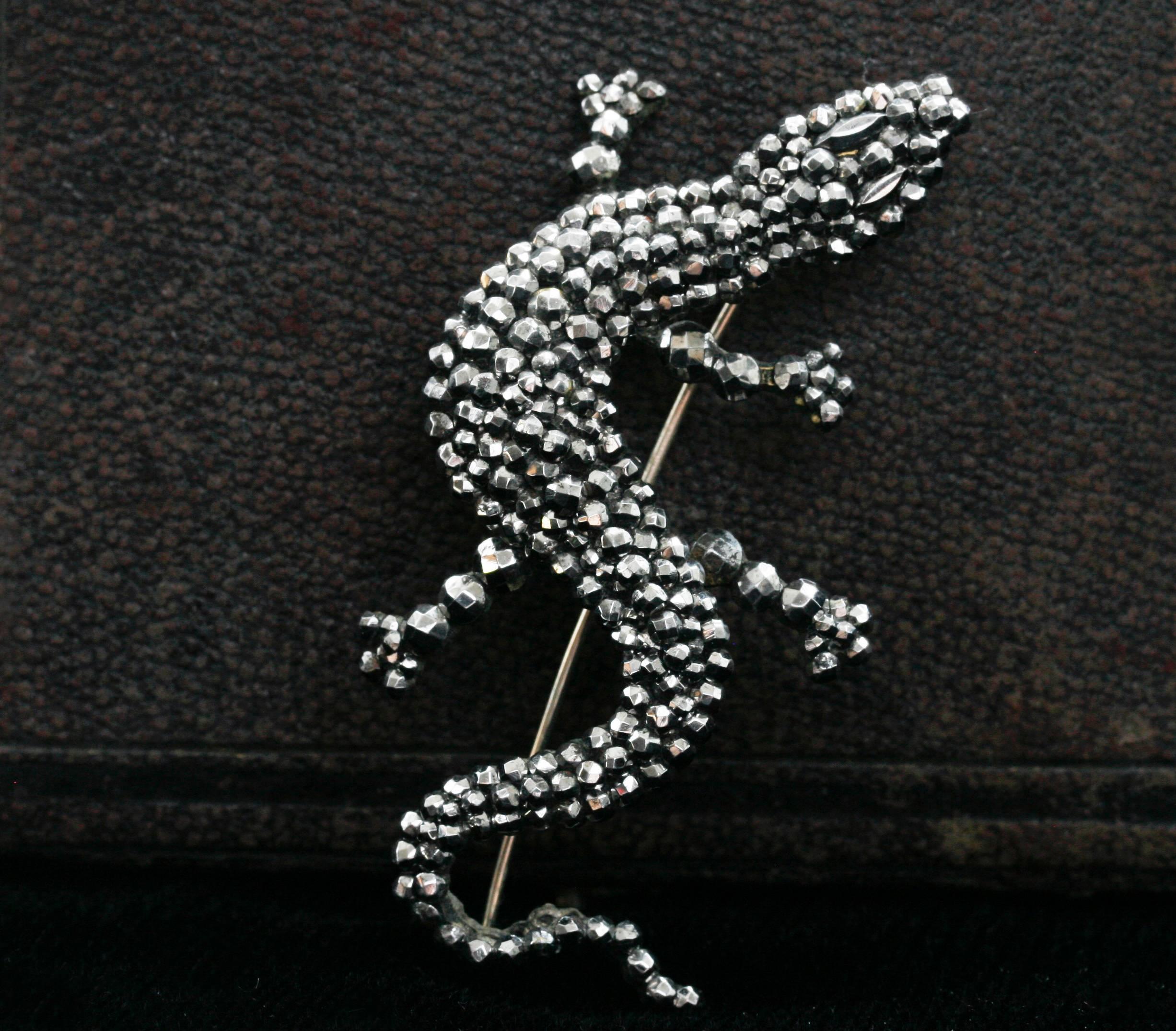C.1840-1850.  A large cut steel lizard brooch. Cut steel jewelry was introduced in the Georgian era around the mid-1700s. This particular type of jewelry is made with polished steel-faceted studs to create a beautiful, dazzling diamond effect. Cut