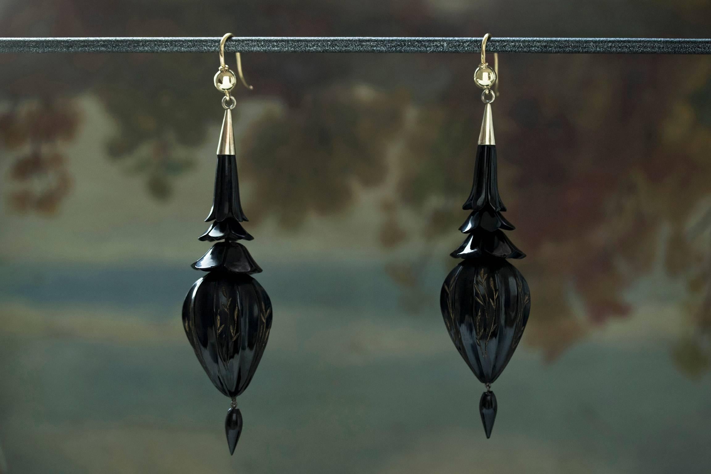 C.1880. A gorgeous pair of Victorian carved Whitby jet drop earrings. The earrings have three-tier fluted tops, and the lower body of the earrings shows beautiful etching on it. They are very wearable/lightweight, and give lovely movement when worn.